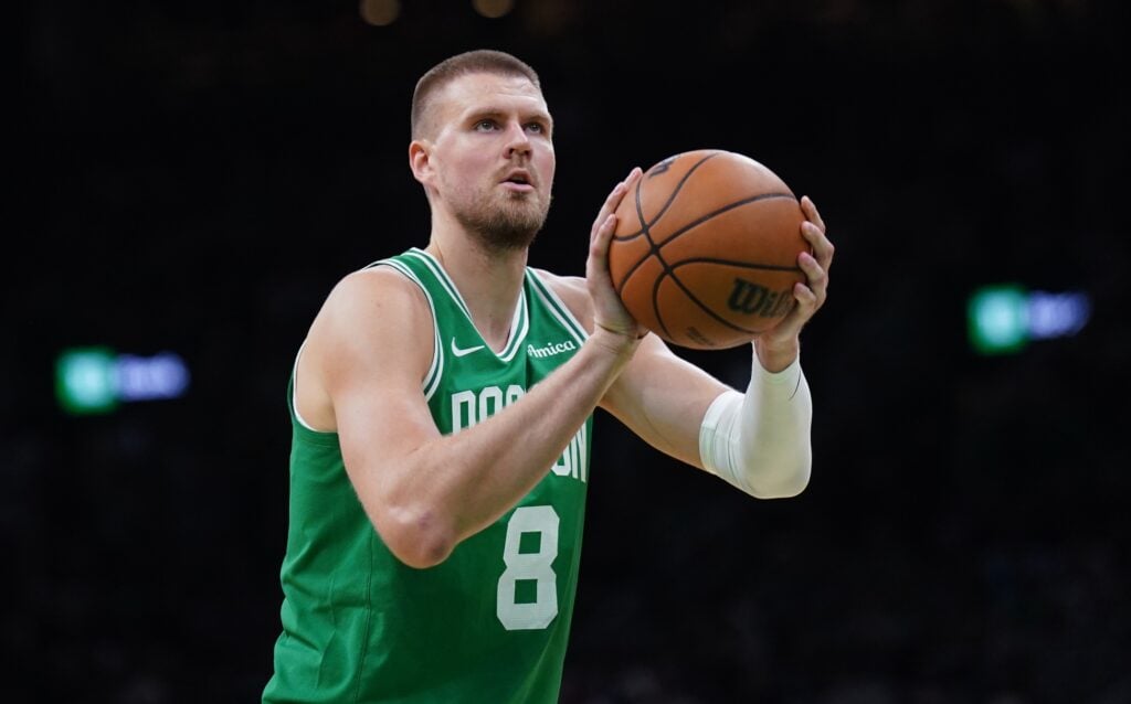 May 7, 2025; Boston, Massachusetts, USA; Boston Celtics center Kristaps Porzingis (8) shoots a free throw against the New York Knicks in the second half during game two of the second round for the 2025 NBA Playoffs at TD Garden. Mandatory Credit: David Butler II-Imagn Images