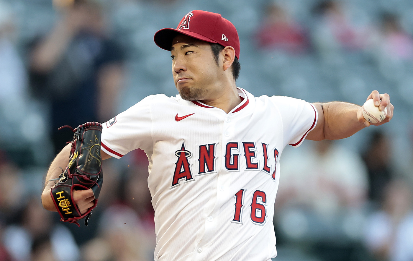 Angels starting pitcher Yusei Kikuchi throws to the plate during...