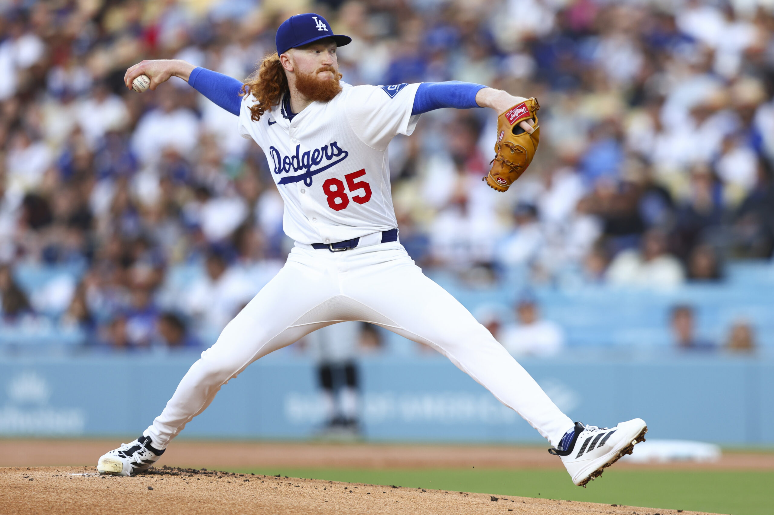 Dodgers starting pitcher Dustin May throws to the plate during...