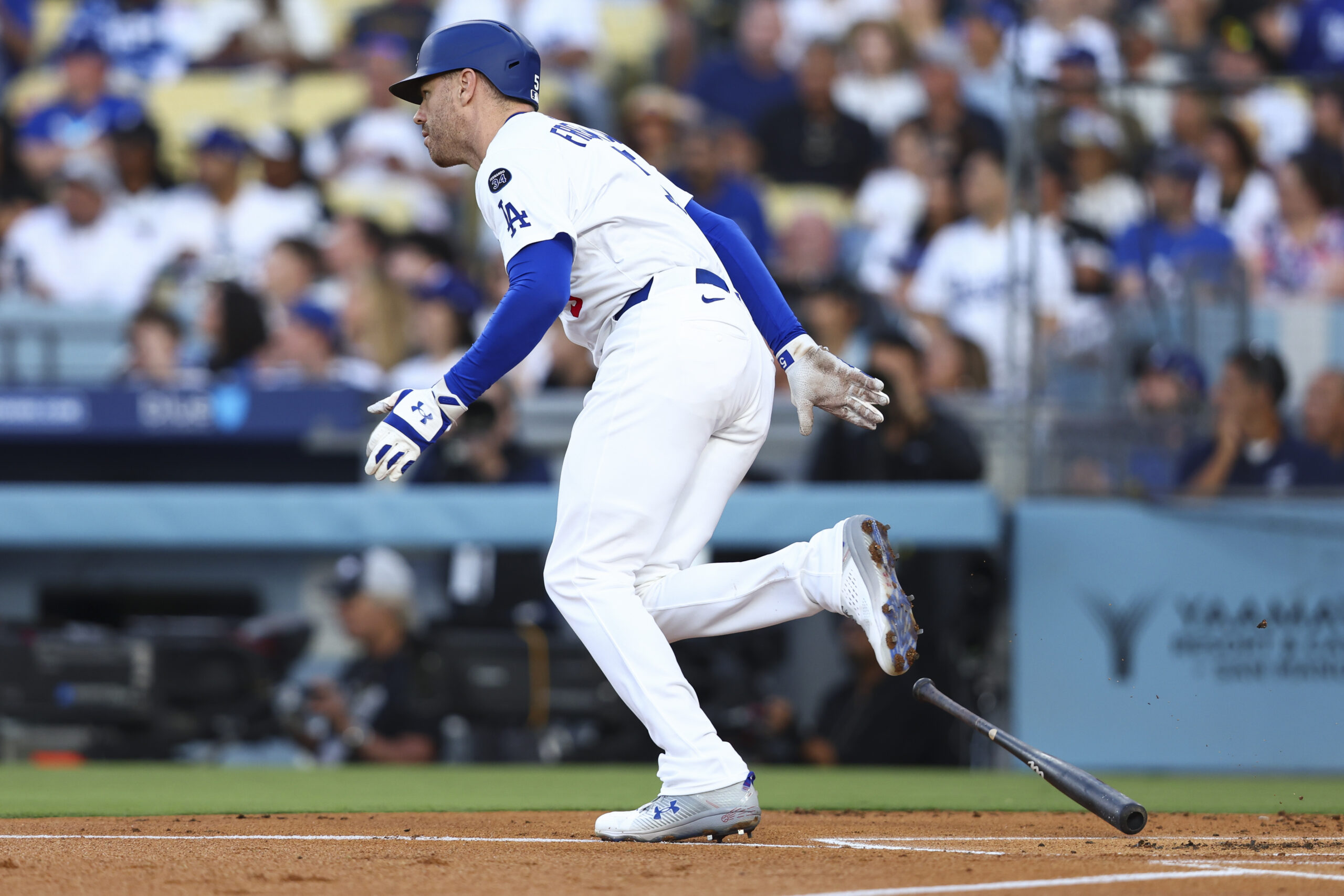 The Dodgers’ Freddie Freeman drops his bat after hitting an...
