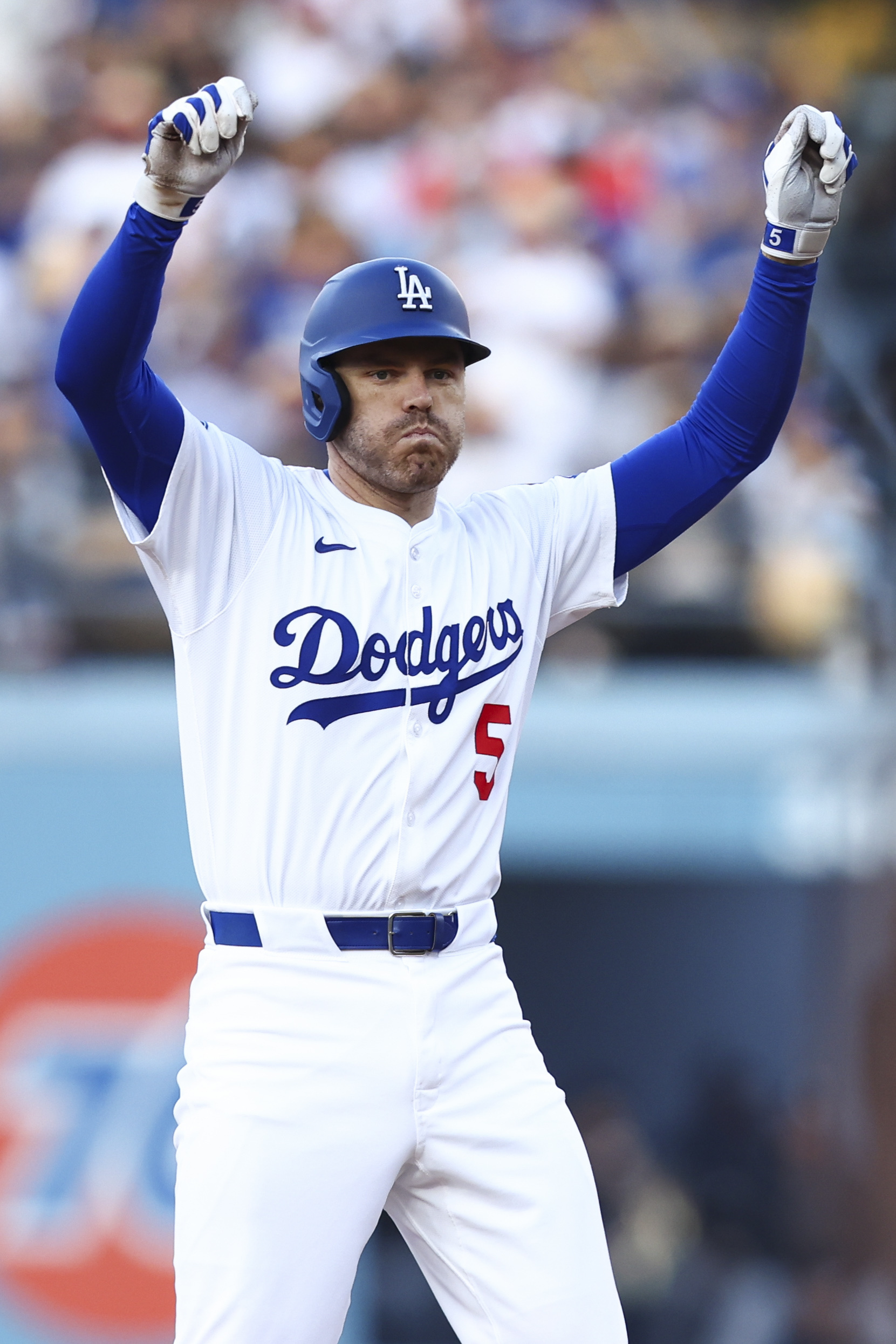 The Dodgers’ Freddie Freeman celebrates after hitting an RBI double...