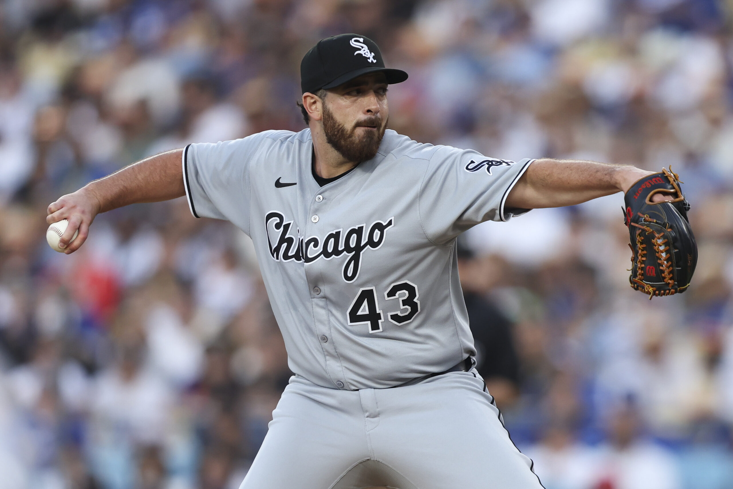Chicago White Sox starting pitcher Aaron Civale throws to a...