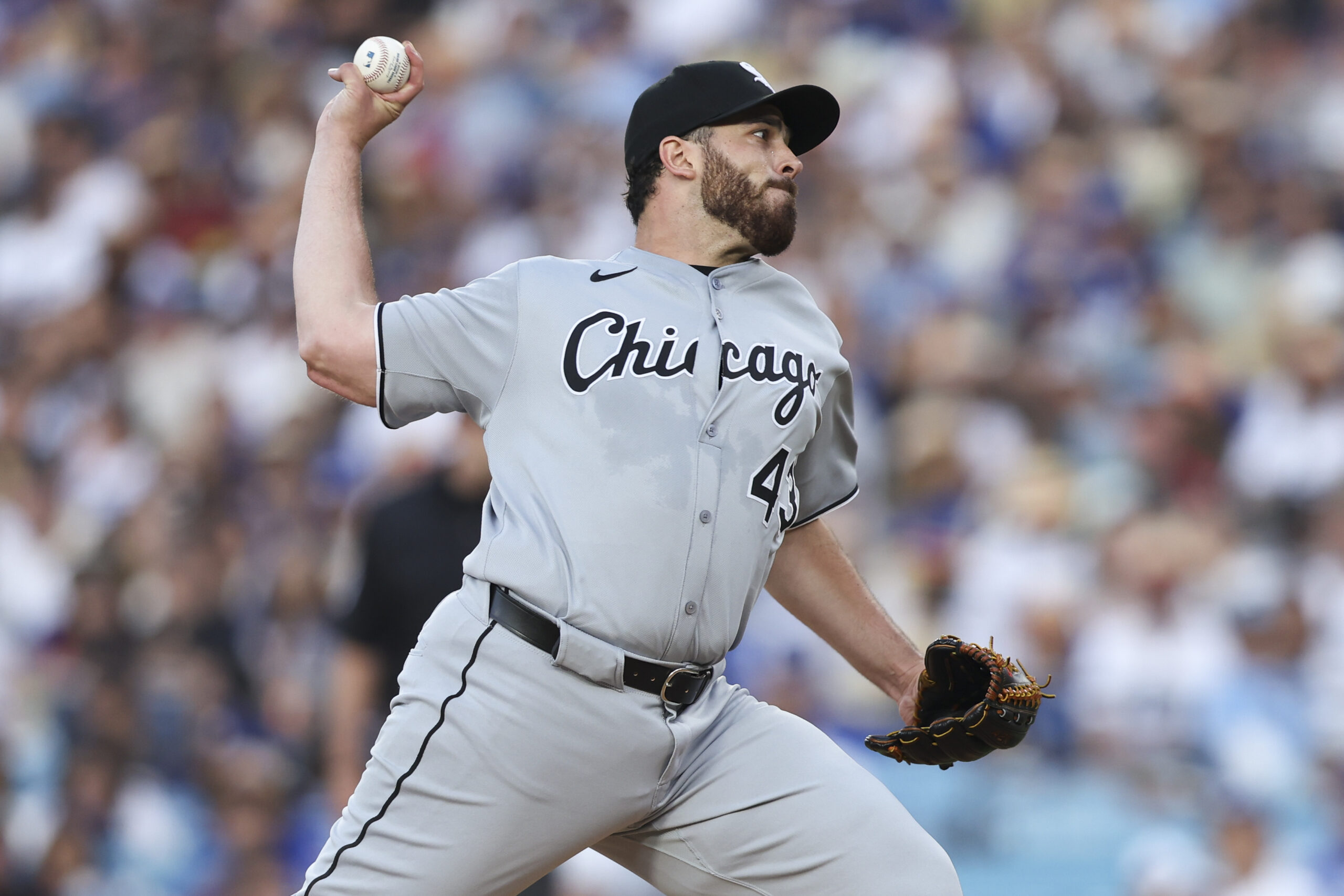 Chicago White Sox starting pitcher Aaron Civale throws to a...