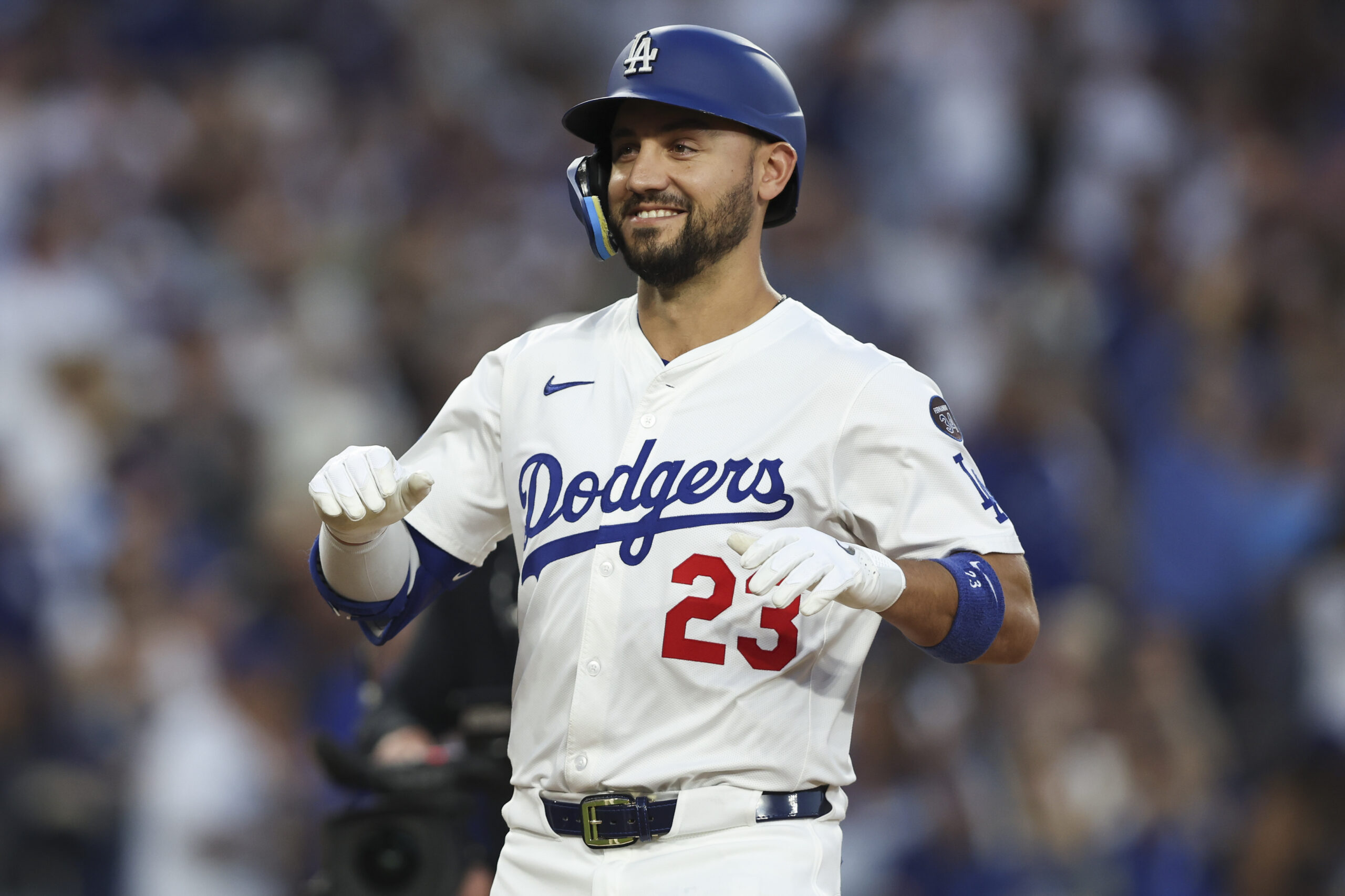 The Dodgers’ Michael Conforto reacts as he reaches home plate...