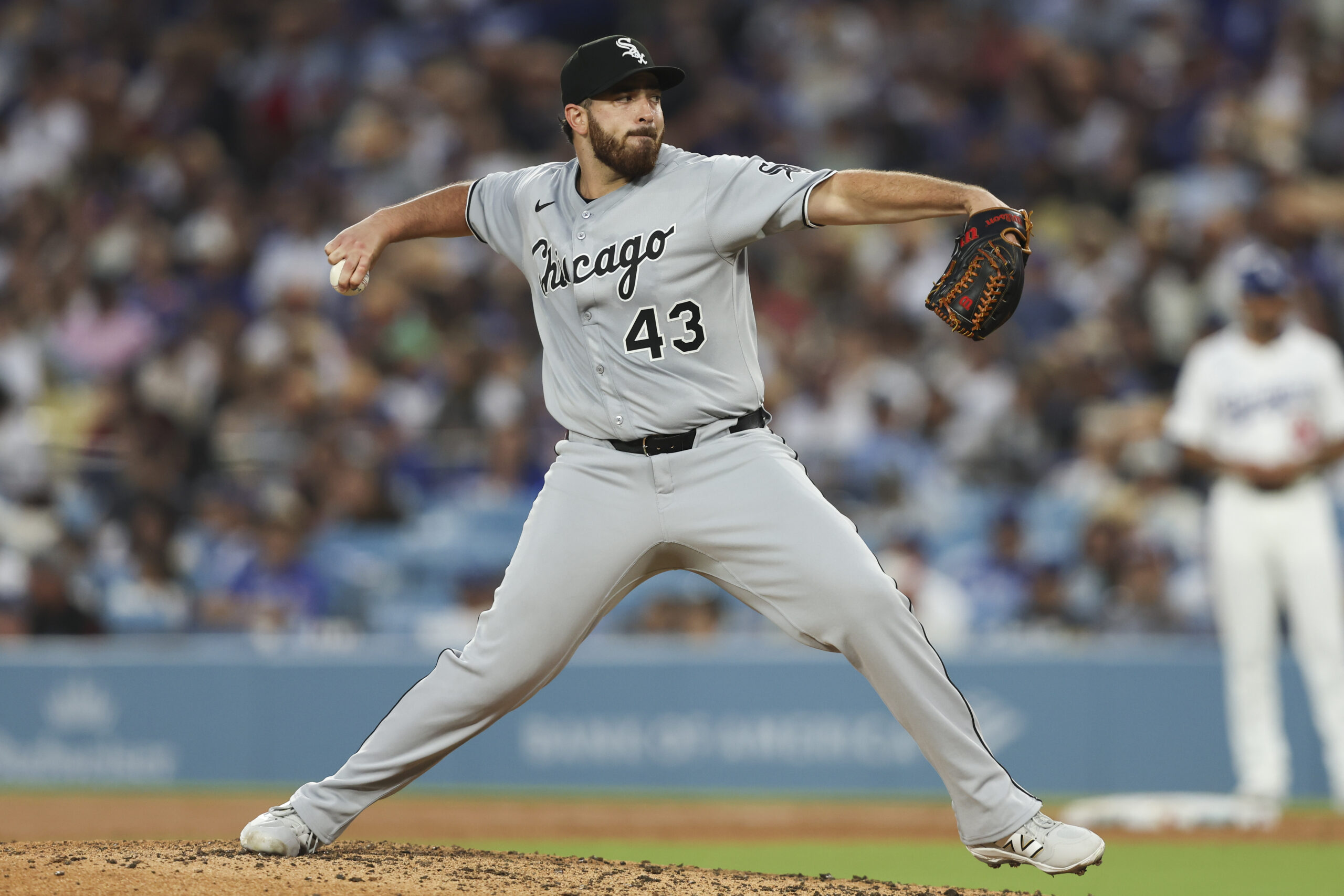 Chicago White Sox starting pitcher Aaron Civale throws to a...