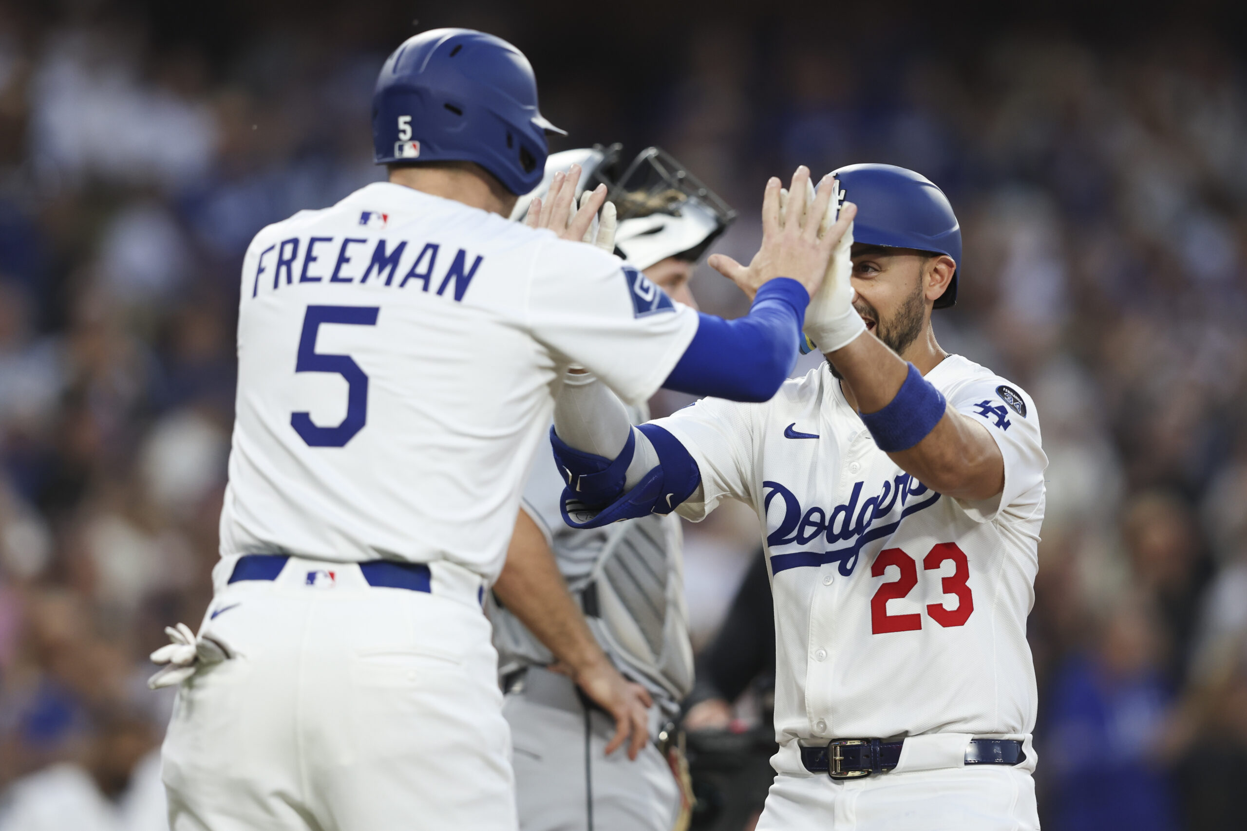 The Dodgers’ Michael Conforto, right, celebrates with teammate Freddie Freeman...