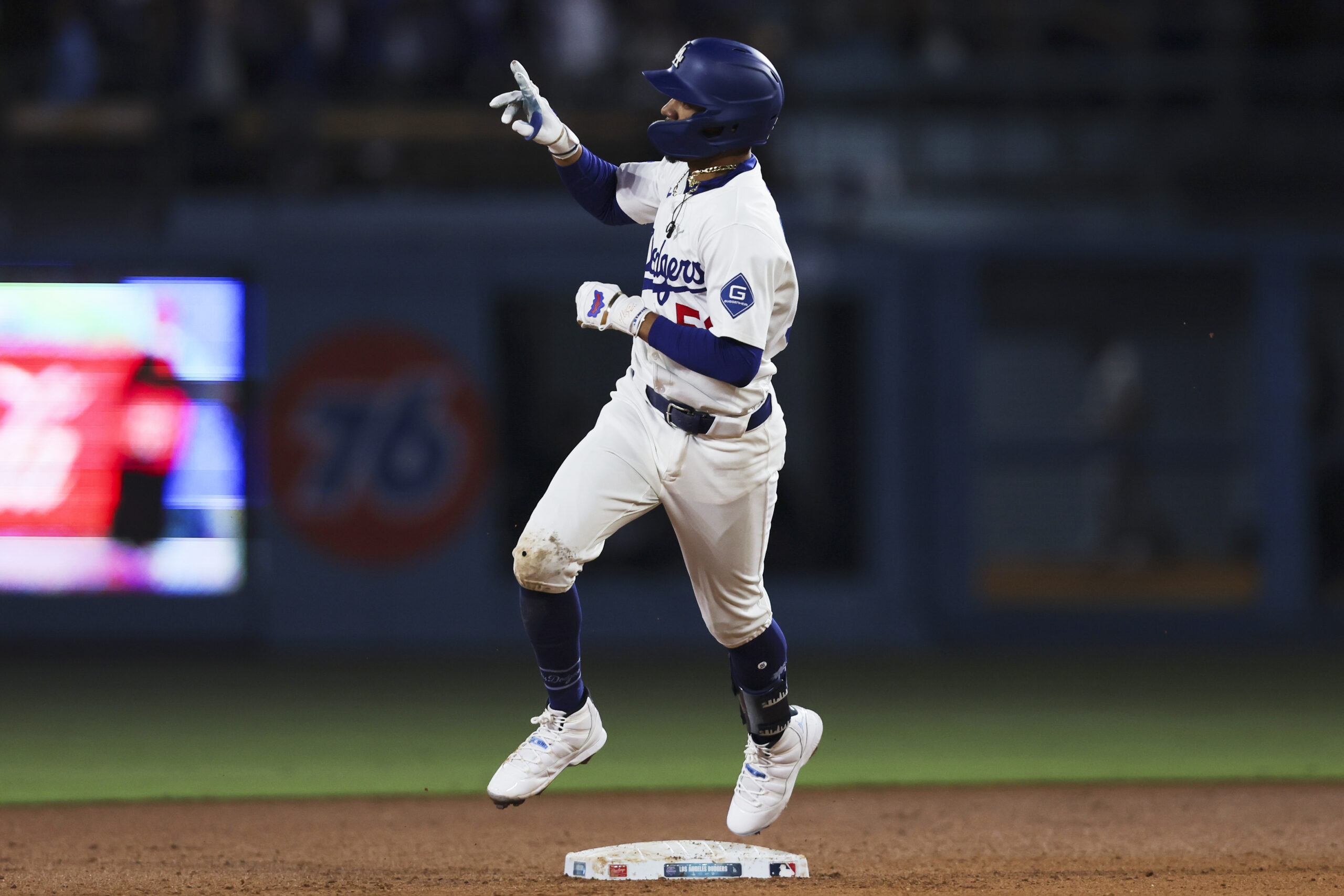 The Dodgers’ Mookie Betts gestures while running the bases after...
