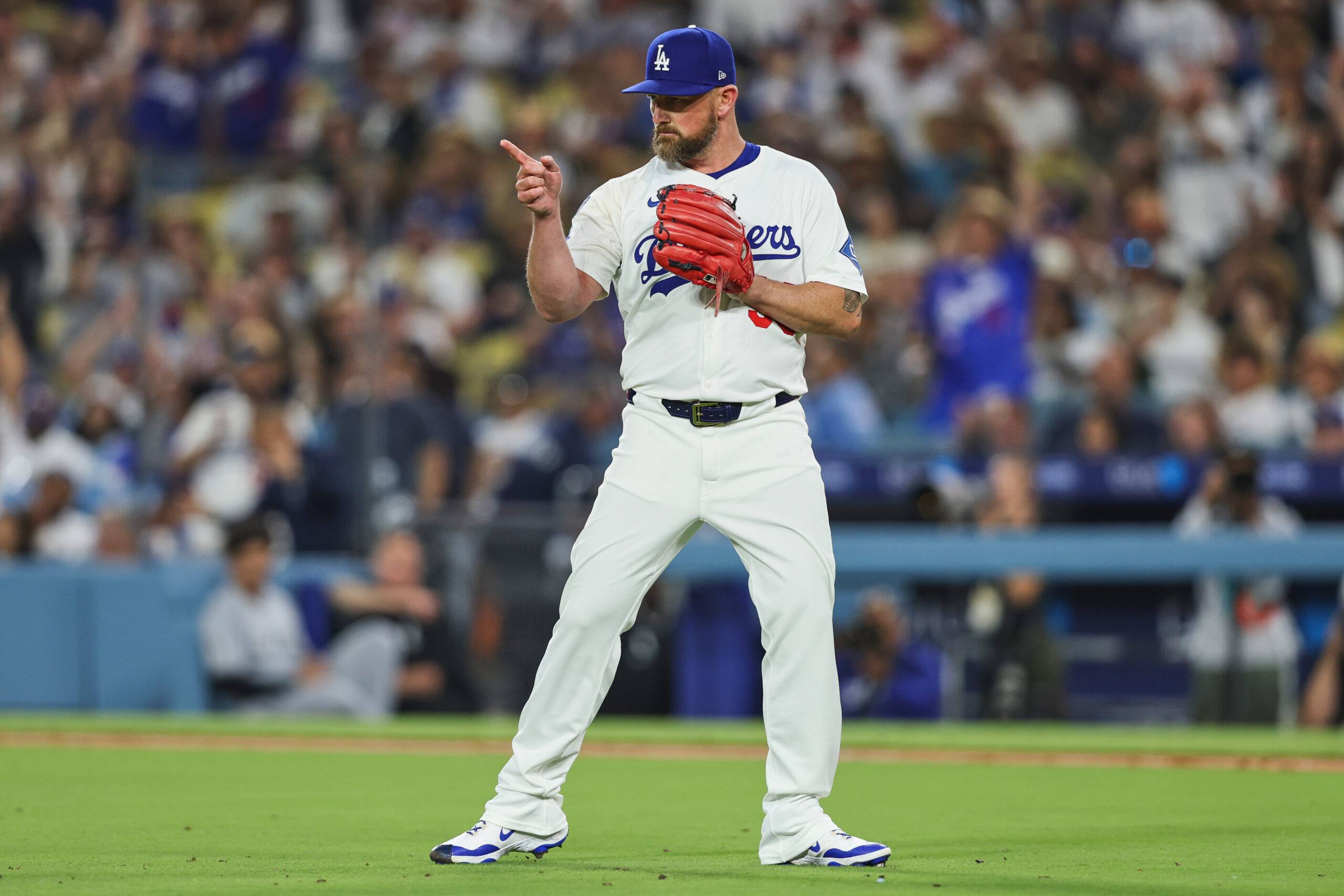 Dodgers relief pitcher Kirby Yates gestures after the final out...