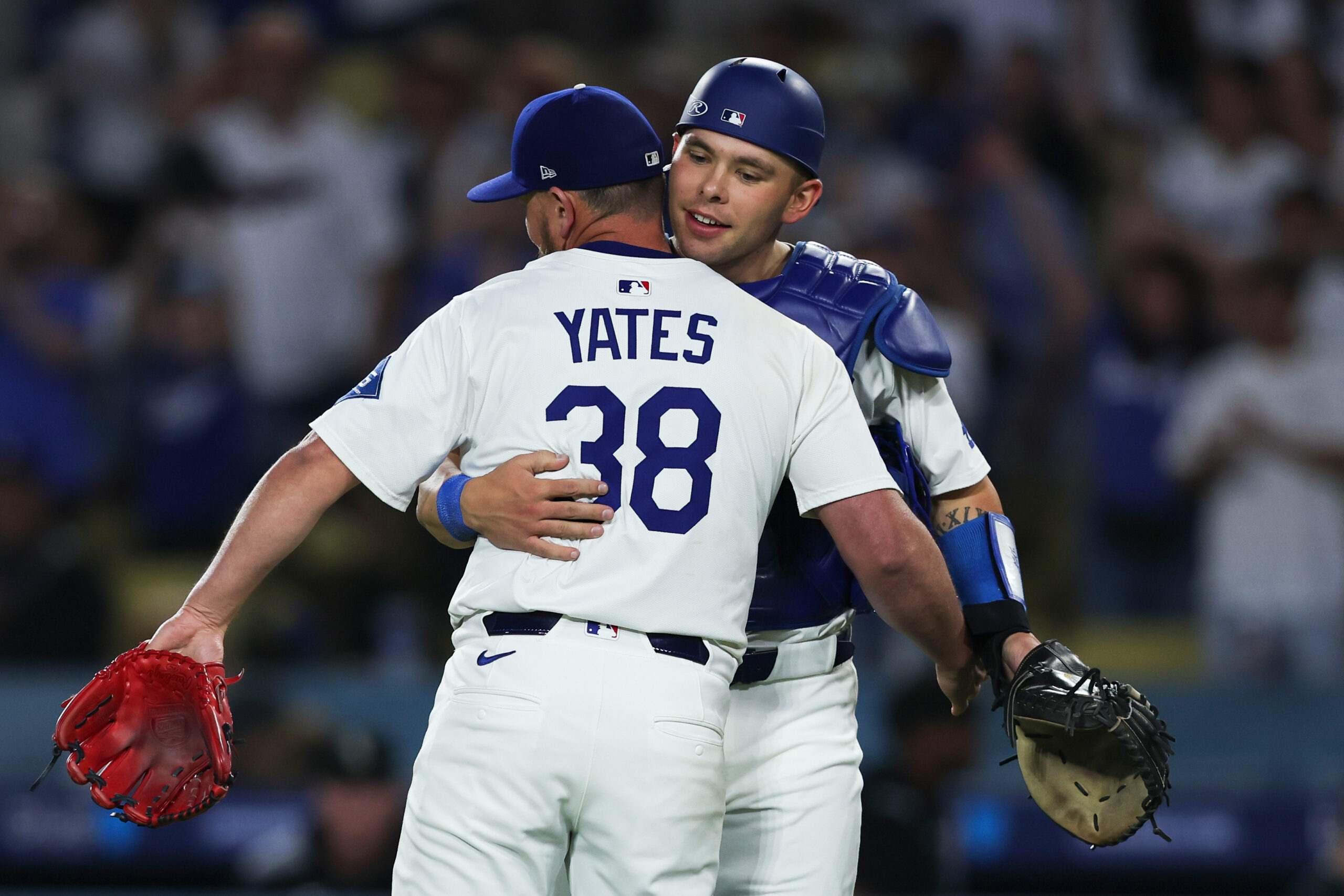 Dodgers relief pitcher Kirby Yates, left, and catcher Dalton Rushing...