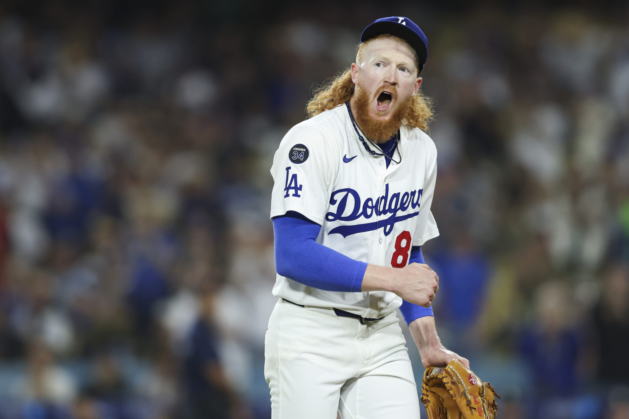 Dodgers starting pitcher Dustin May reacts after being removed during...