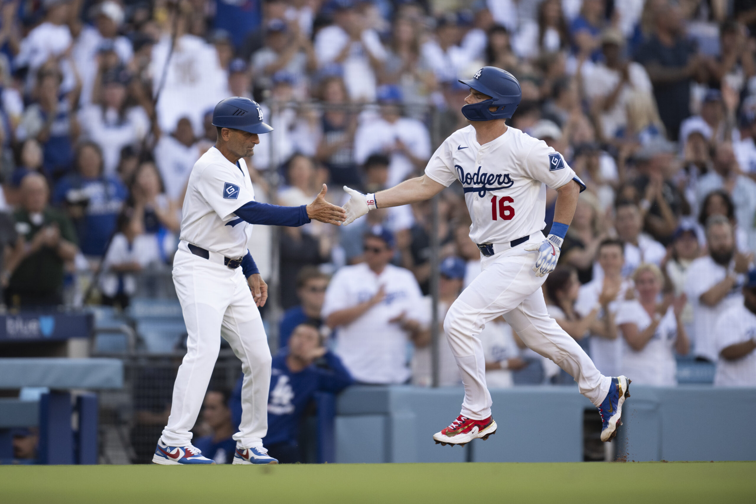 Dodgers’ Will Smith, right, celebrates after his solo home run...