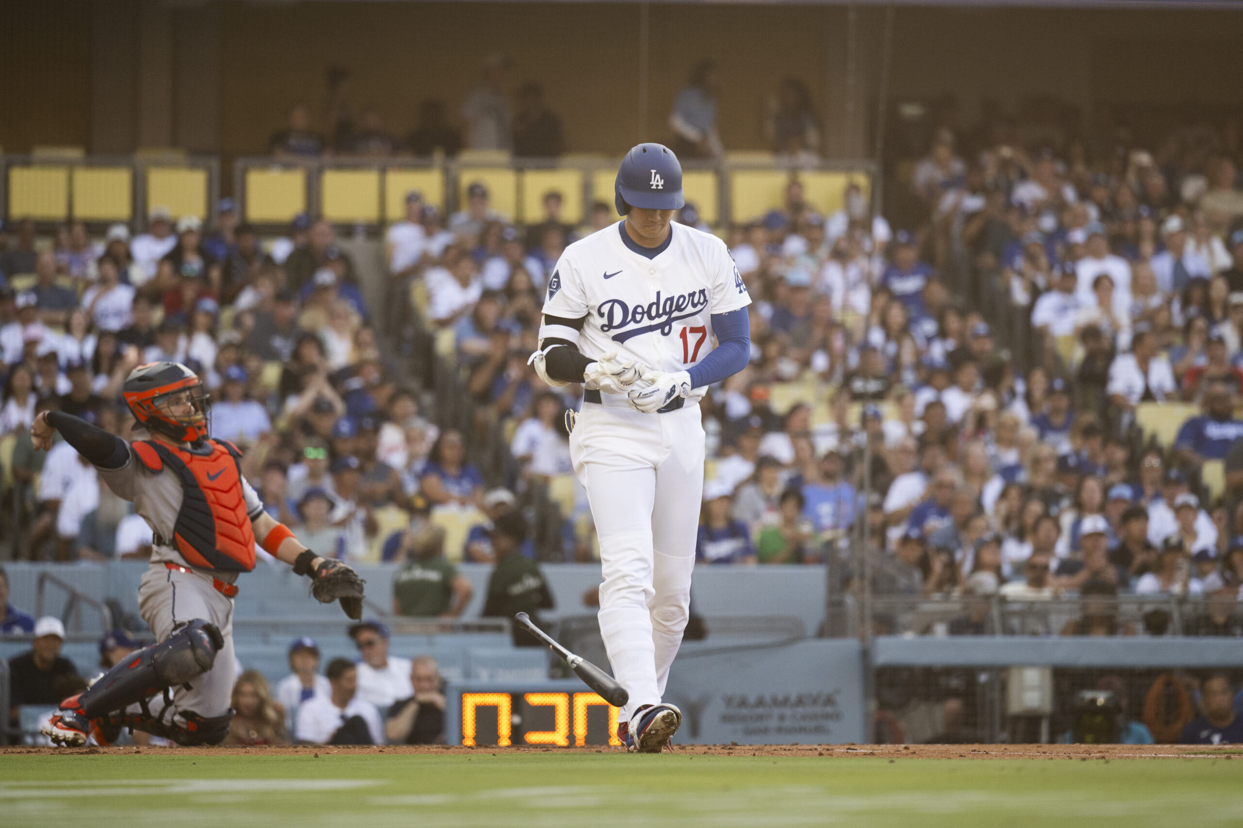 Dodgers’ Shohei Ohtani is walked during the first inning of...
