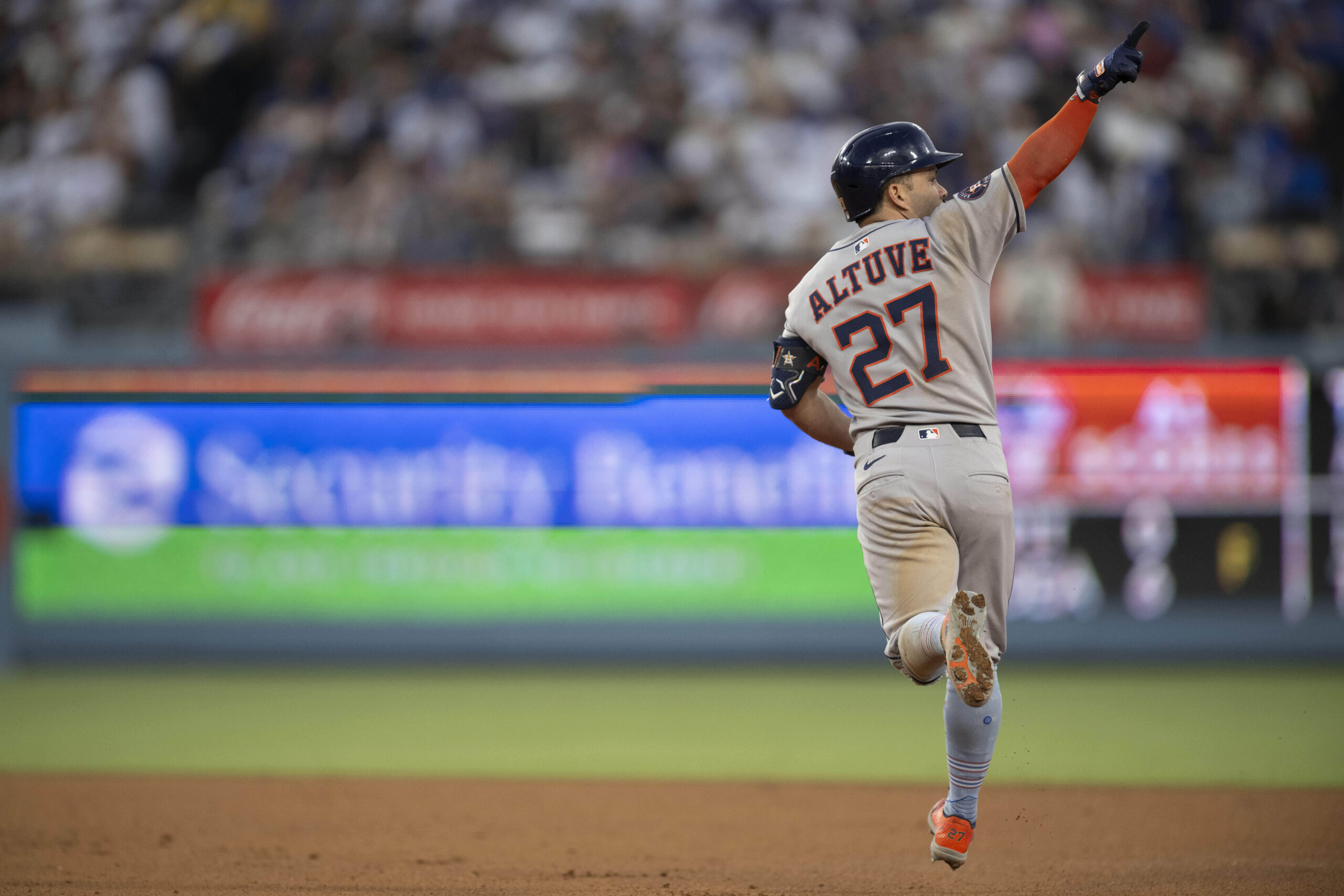 Houston Astros’ Jose Altuve gestures after hitting a three-run home...