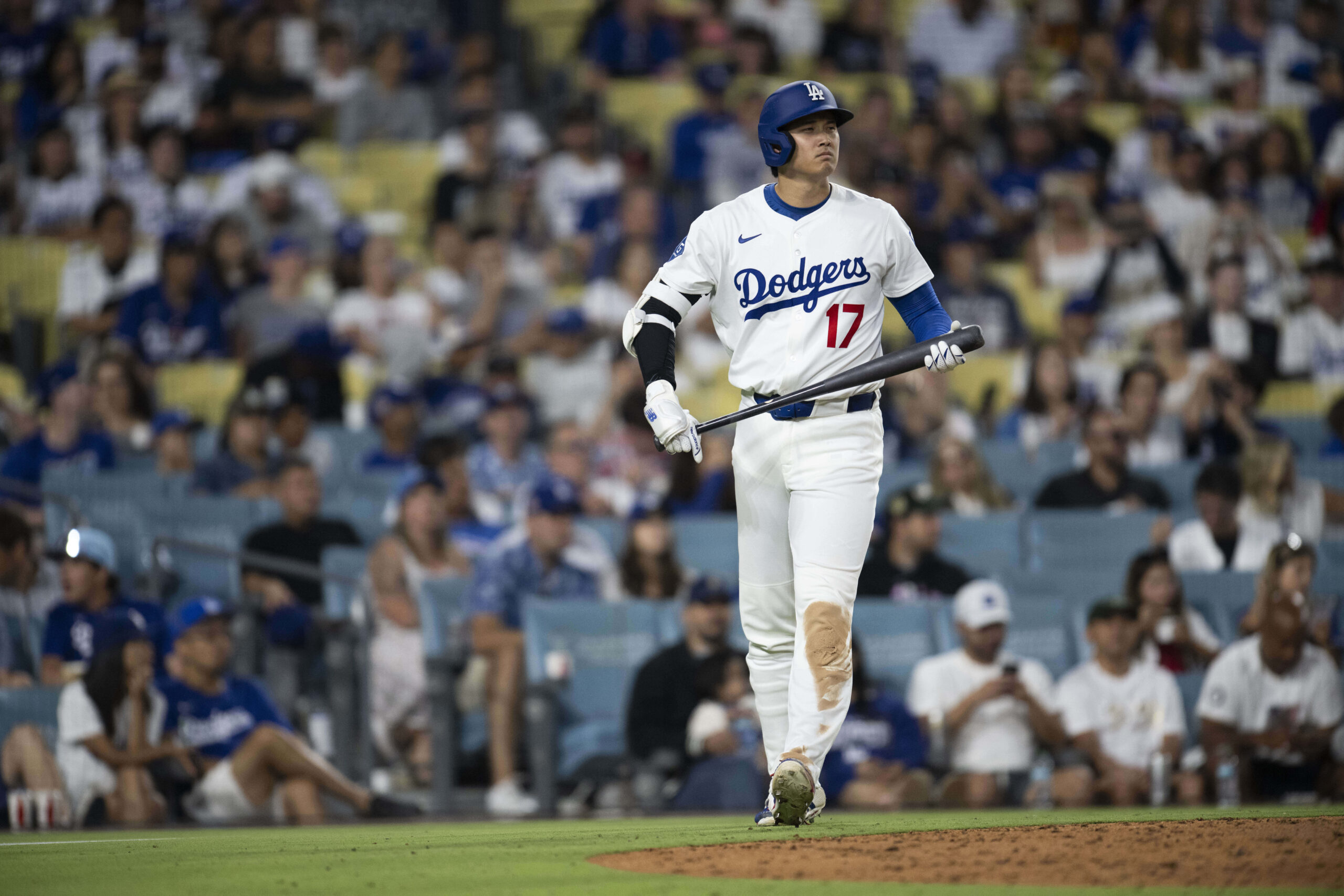 Dodgers’ Shohei Ohtani walks up to bat during the seventh...