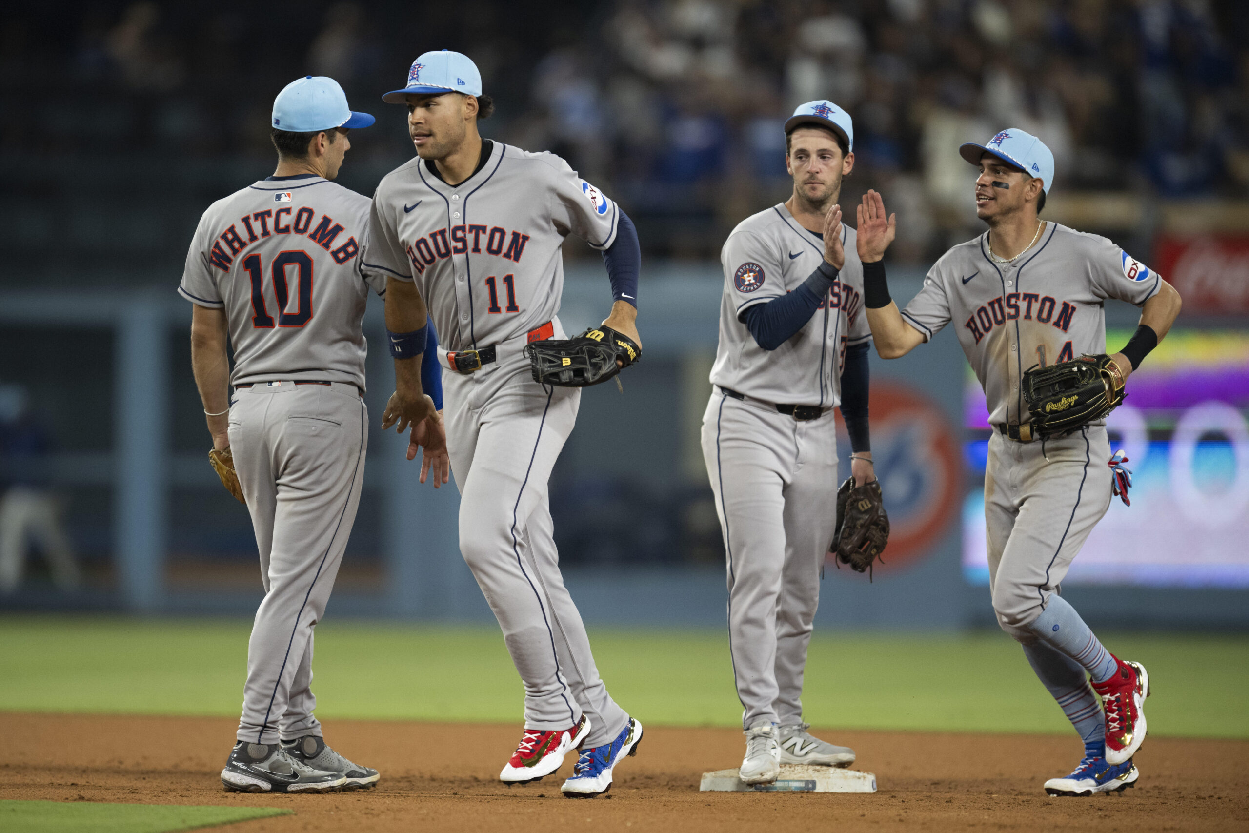 From left, Houston Astros’ Shay Whitcomb, Cam Smith, Zack Short,...