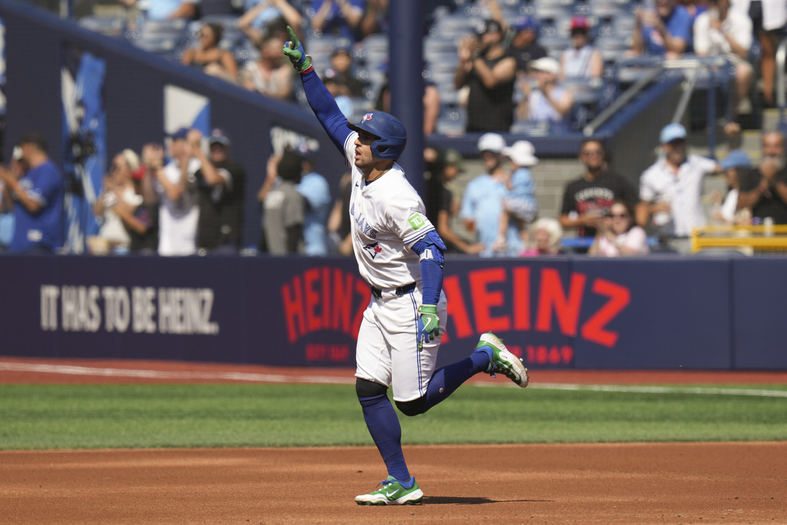 Toronto Blue Jays’ George Springer rounds the bases after hitting...