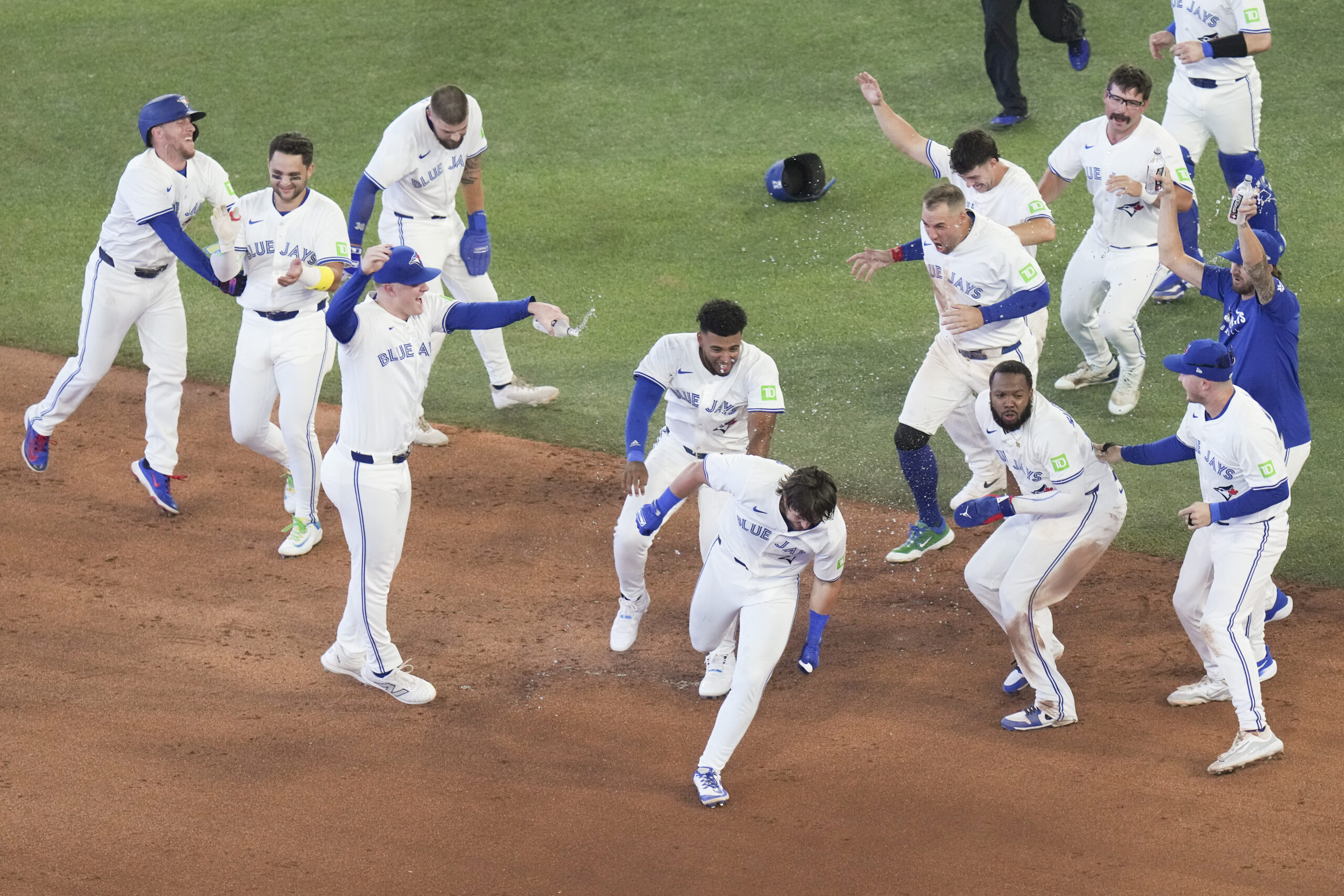 Toronto Blue Jays’ Addison Barger, center front, celebrates with teammates...