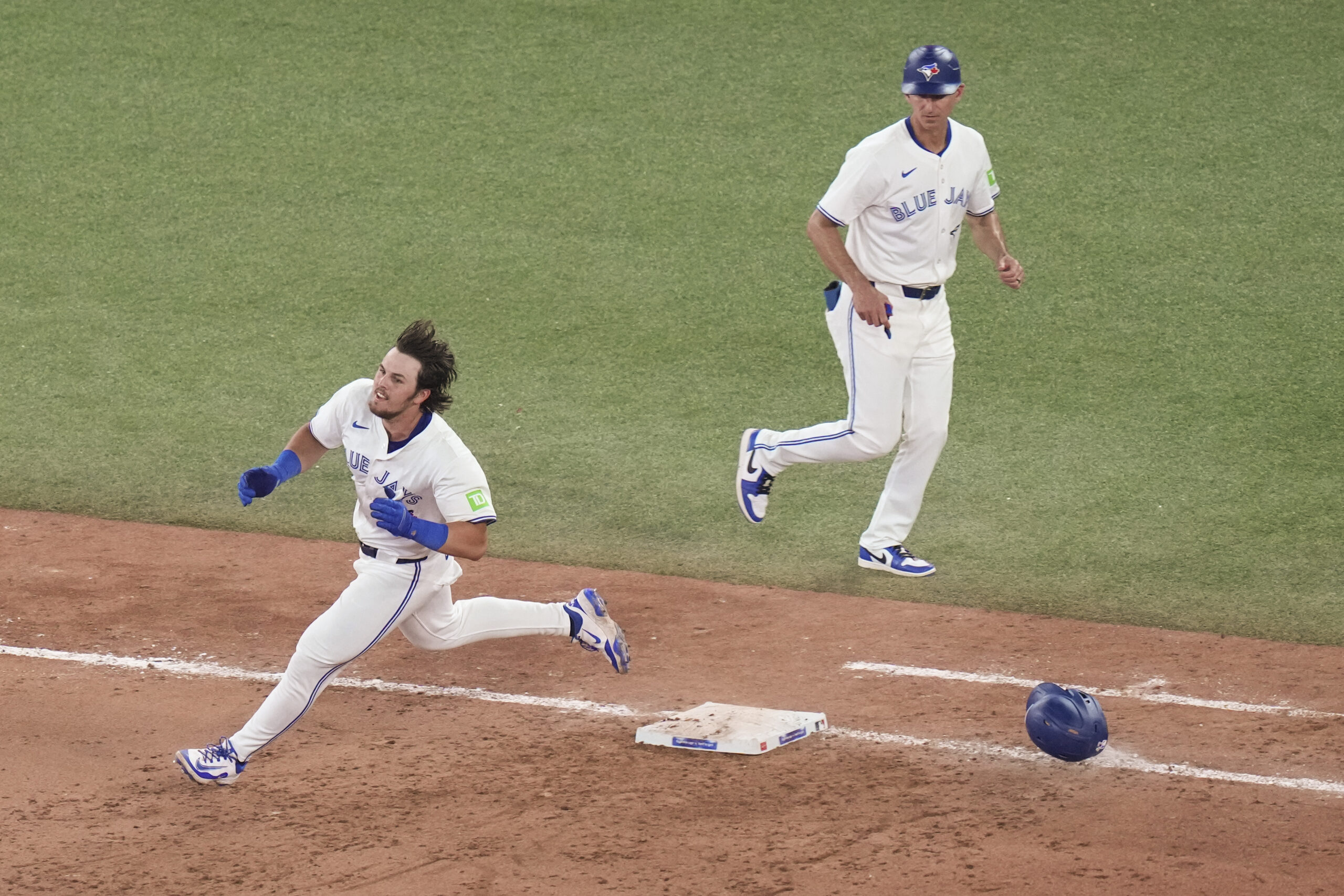 Toronto Blue Jays’ Addison Barger (47) rounds the bases after...