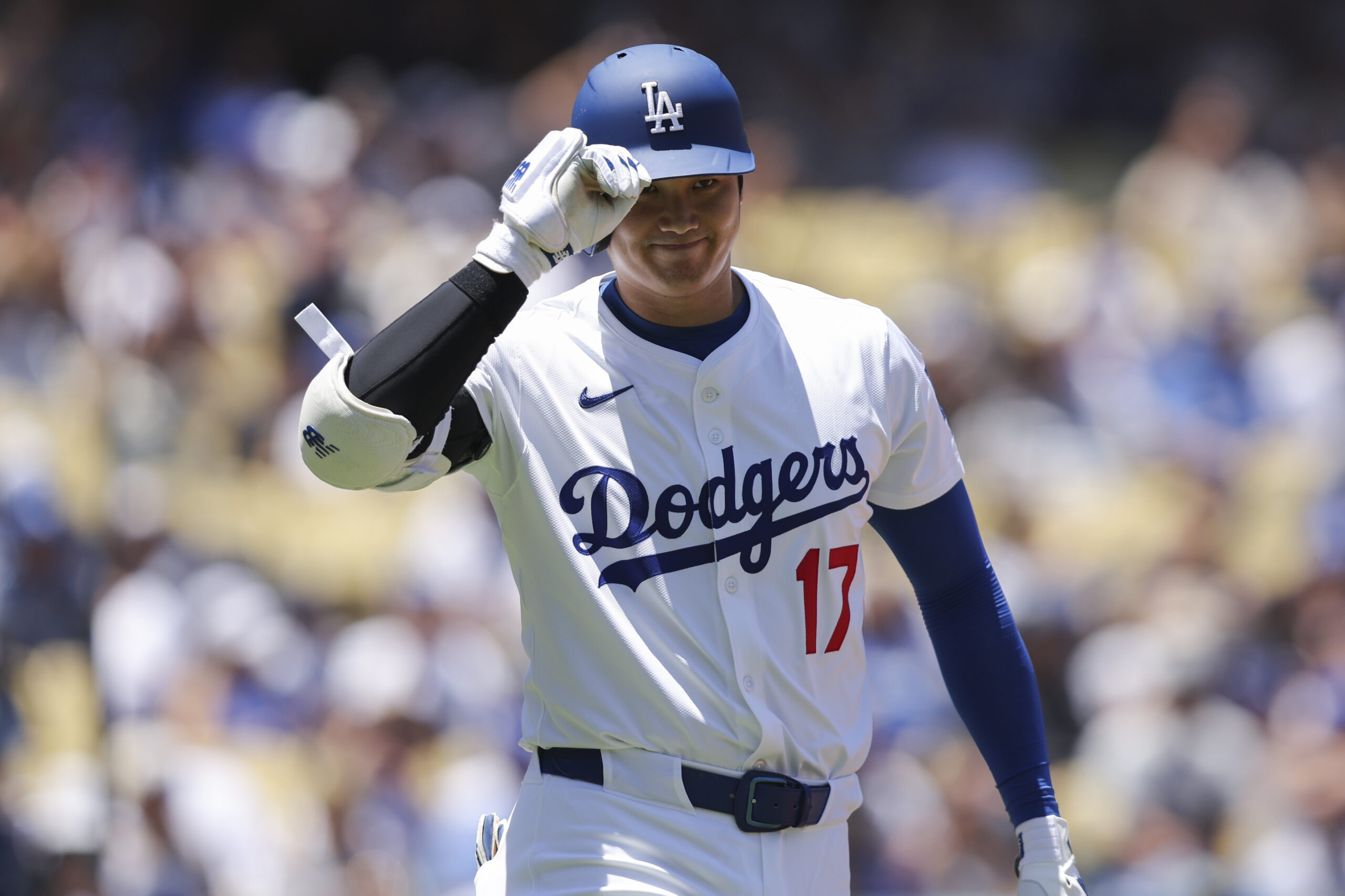 Dodgers designated hitter Shohei Ohtani gestures during the first inning...