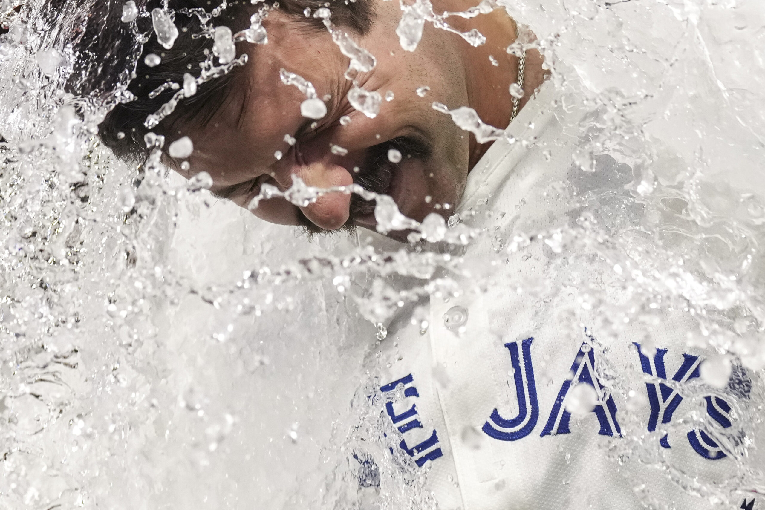 Toronto Blue Jays’ Davis Schneideris doused after his sixth-inning go-ahead...