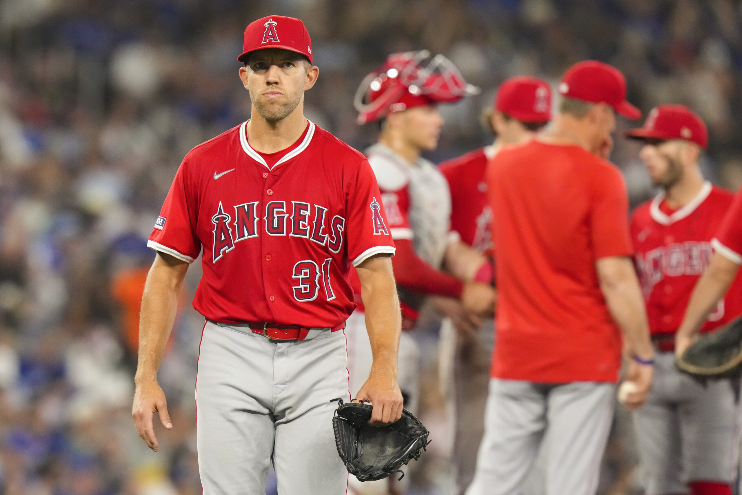 Angels pitcher Tyler Anderson (31) walks back to the dugout...