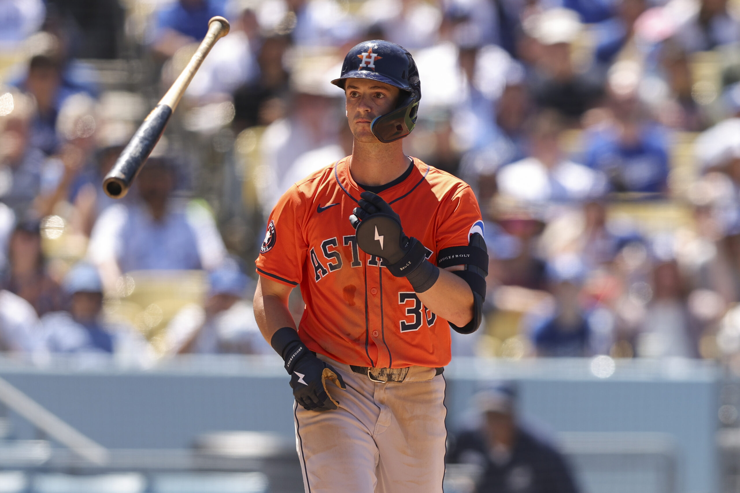 Houston Astros’ Zack Short tosses his bat after being walked...