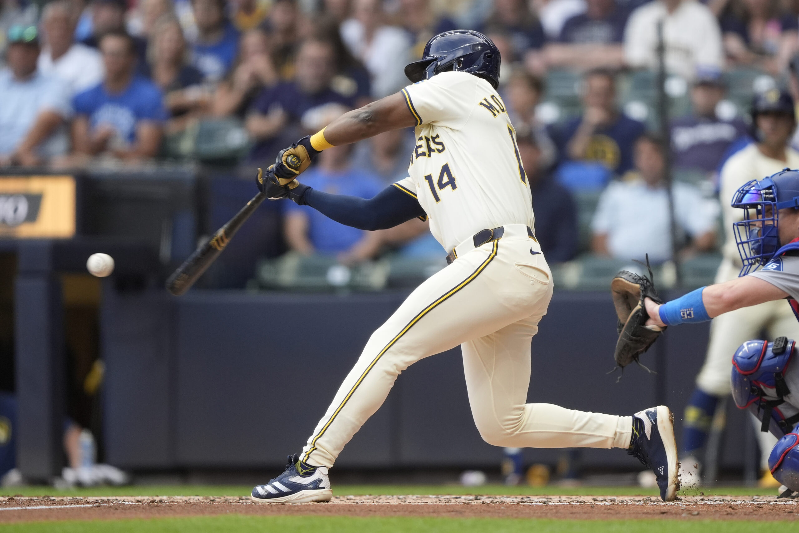 The Milwaukee Brewers’ Andruw Monasterio hits an RBI single during...