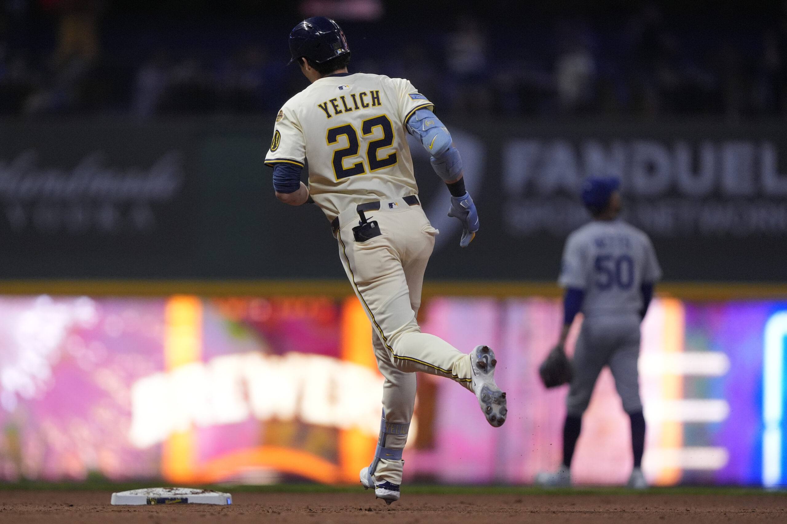 The Milwaukee Brewers’ Christian Yelich runs the bases after hitting...