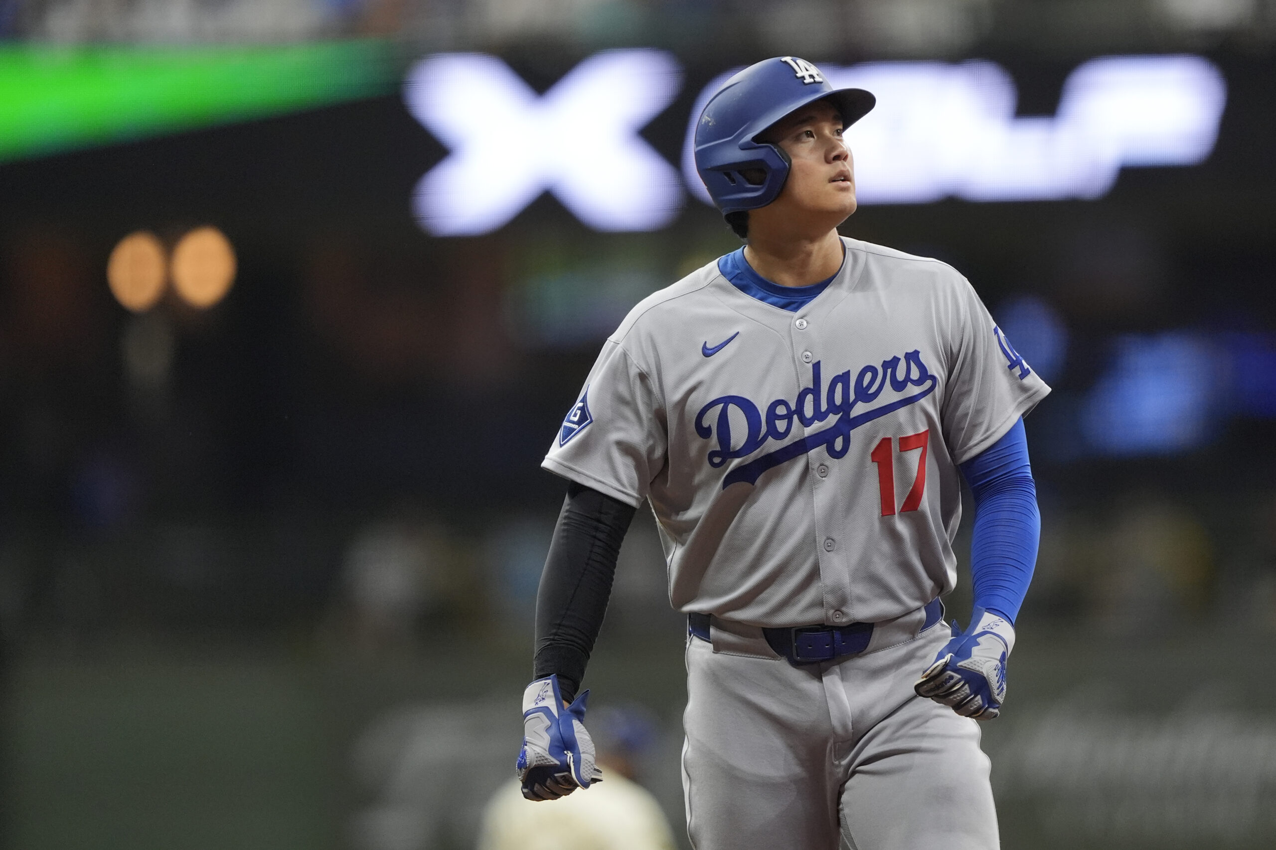 Dodgers star Shohei Ohtani looks on during the eighth inning...