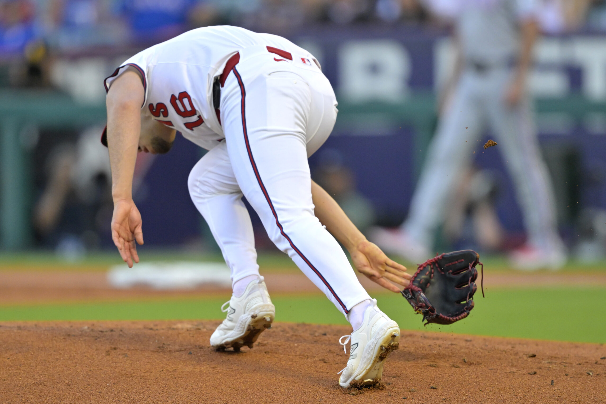 Angels starting pitcher Yusei Kikuchi loses his glove and flips...