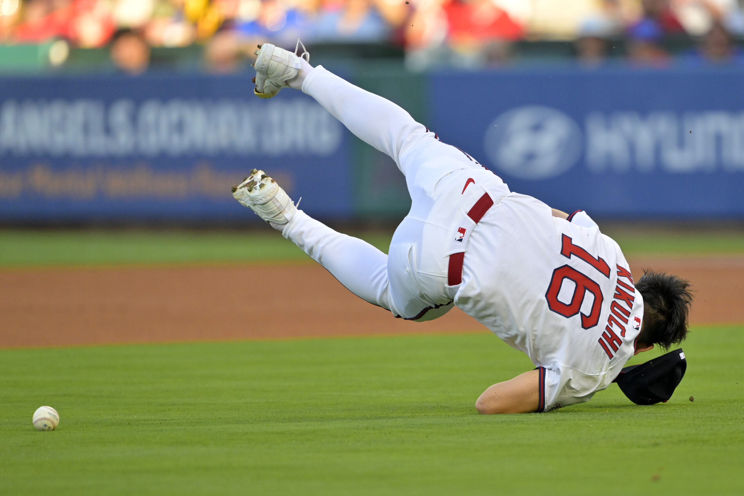 Angels starting pitcher Yusei Kikuchi loses his glove and flips...