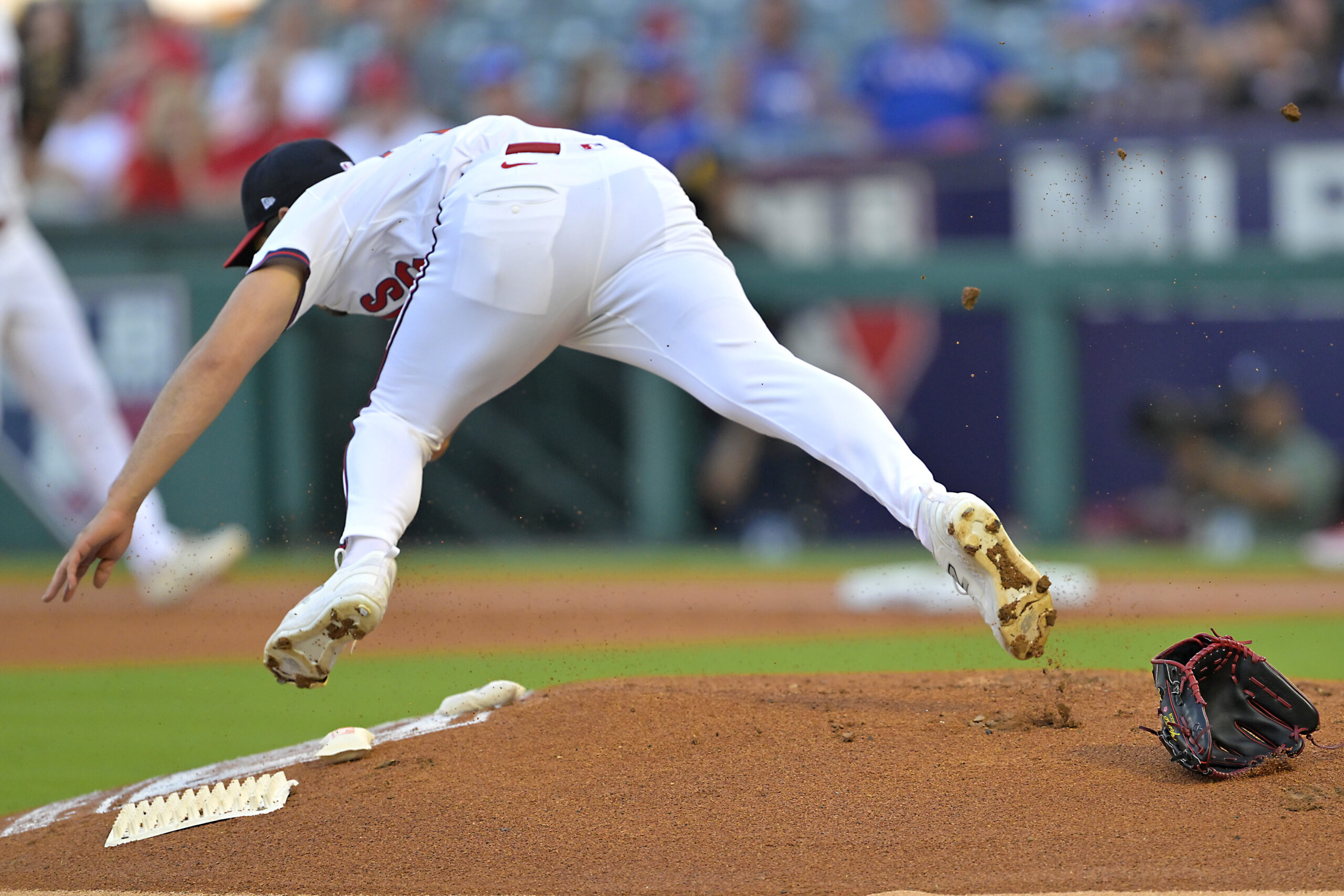 Angels starting pitcher Yusei Kikuchi loses his glove and flips...