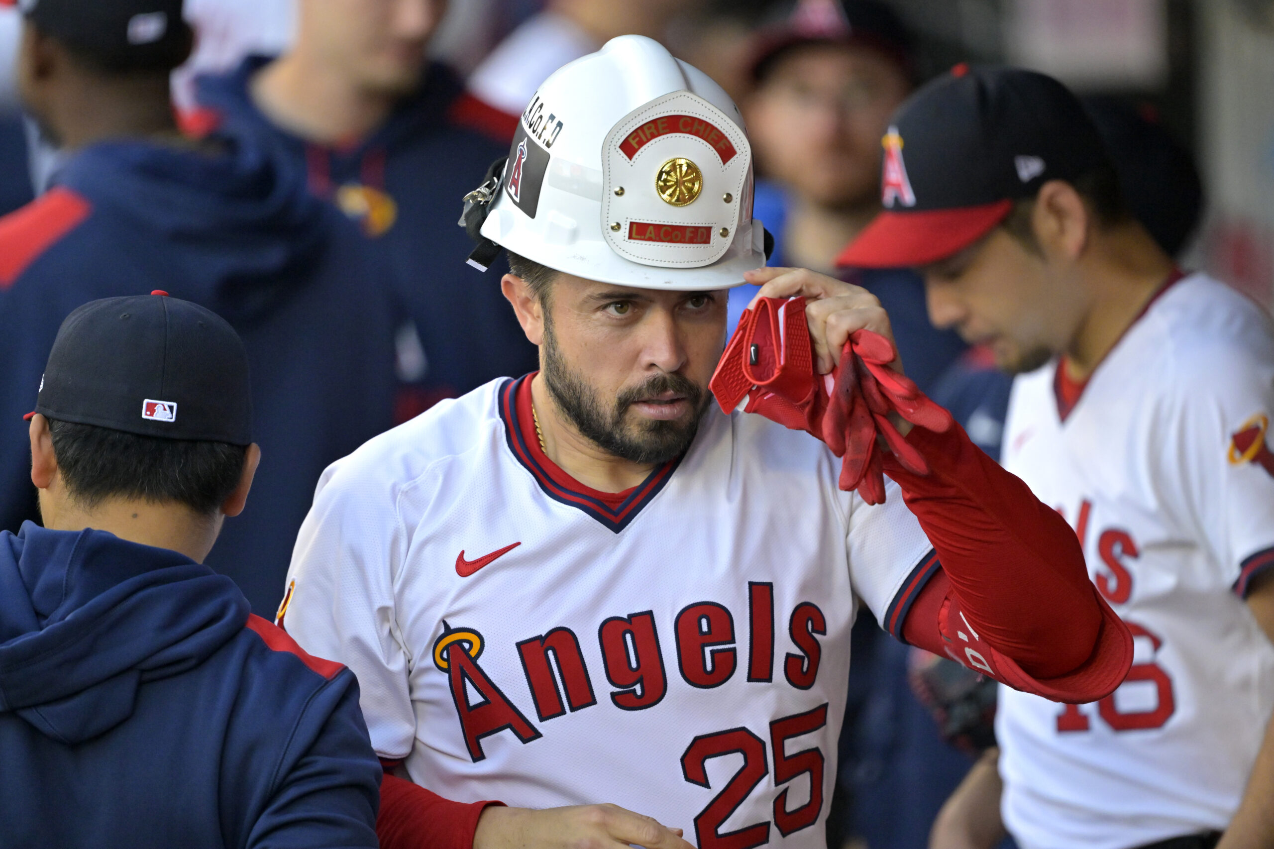 The Angels’ Travis d’Arnaud is congratulated in the dugout after...