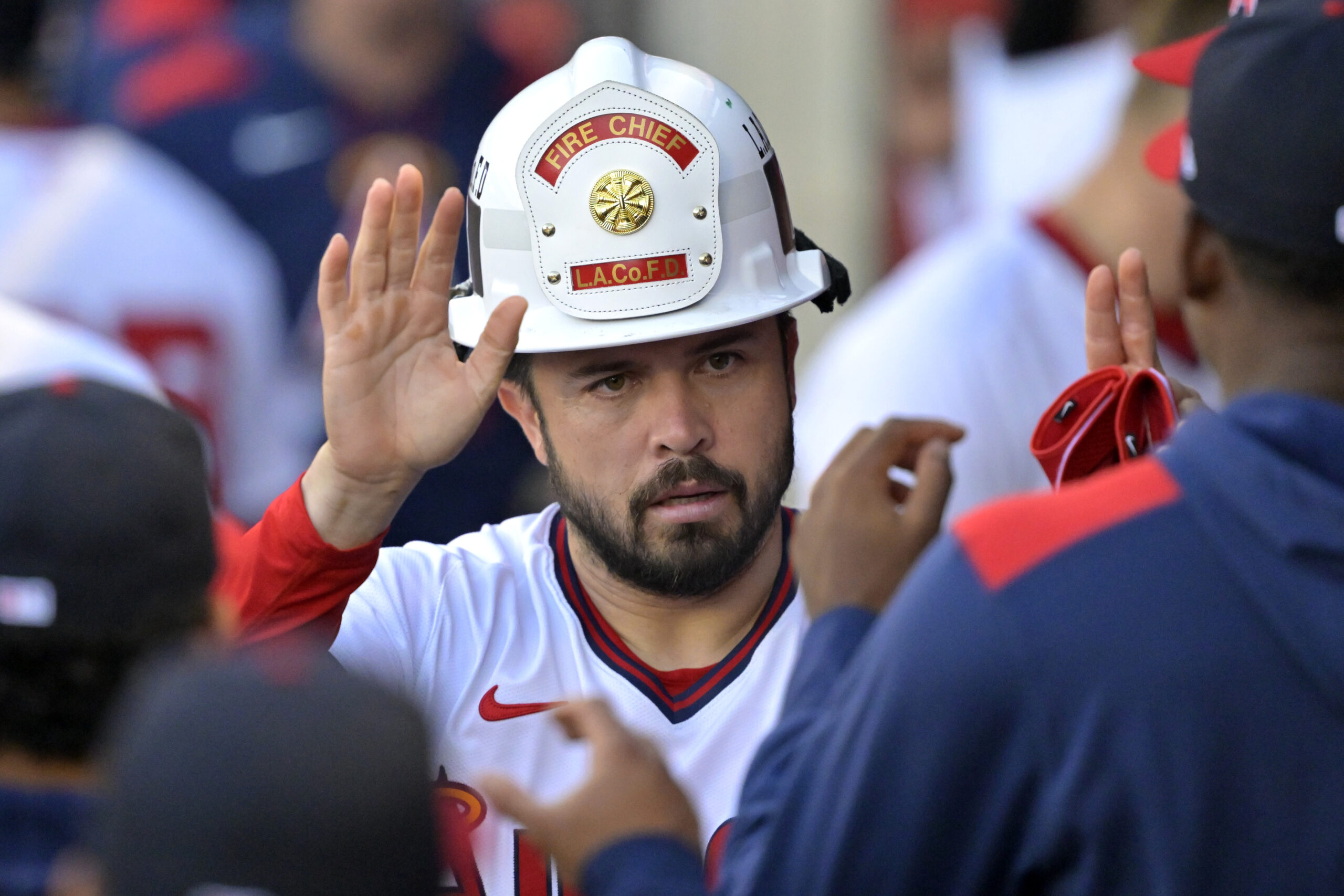 The Angels’ Travis d’Arnaud is congratulated in the dugout after...