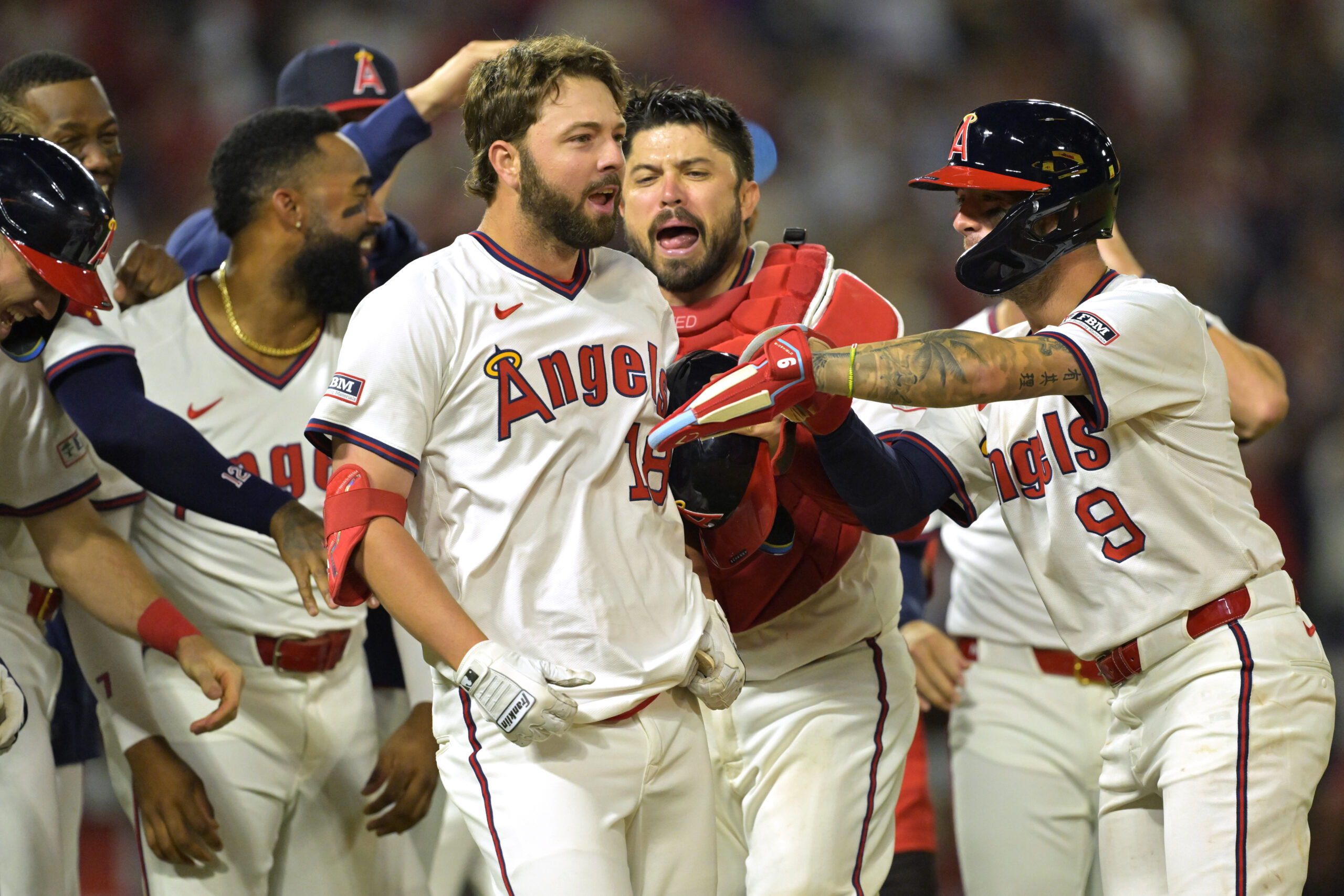 The Angels’ Nolan Schanuel, center, celebrates with teammates after working...