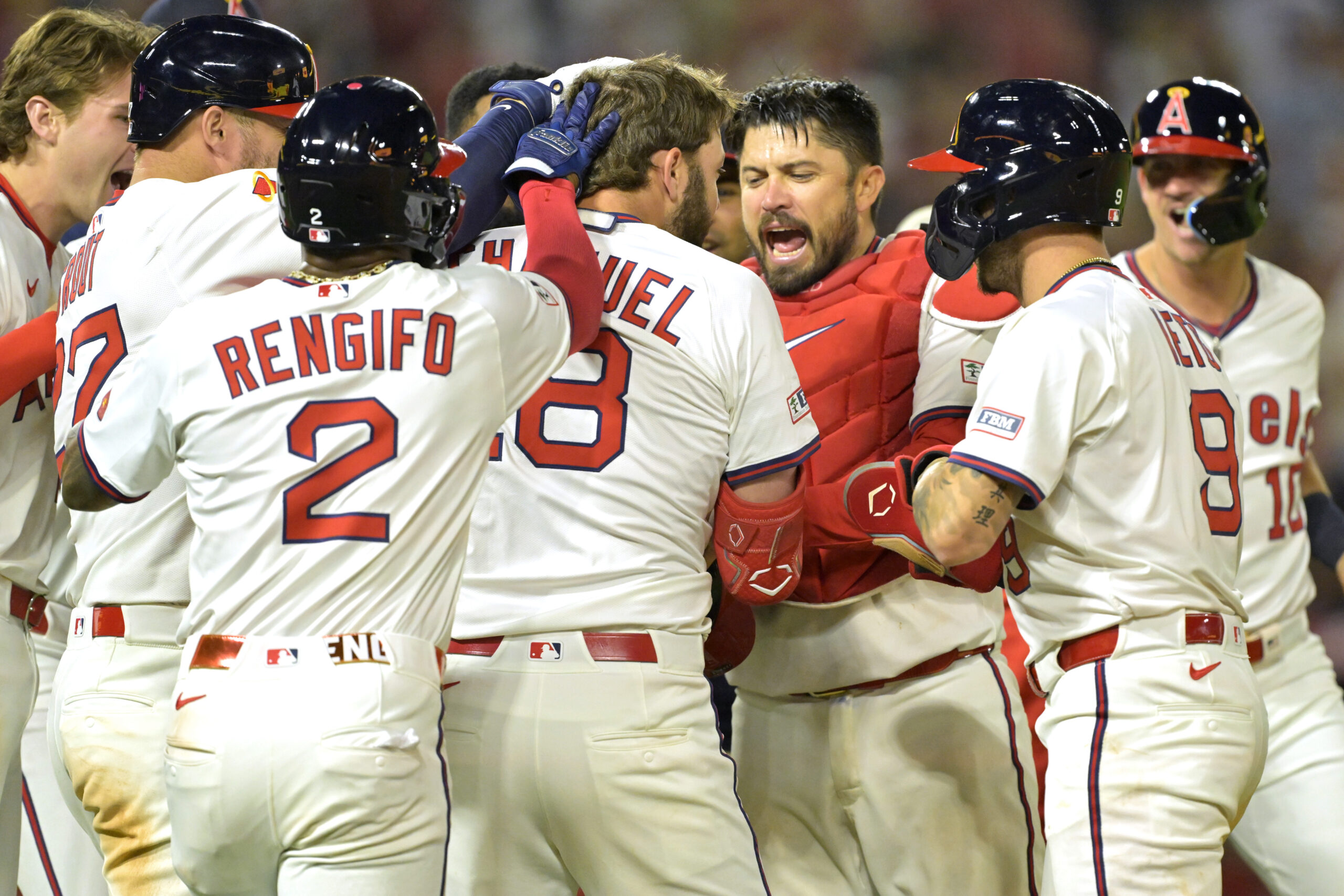 The Angels’ Nolan Schanuel (18) celebrates with teammates after working...