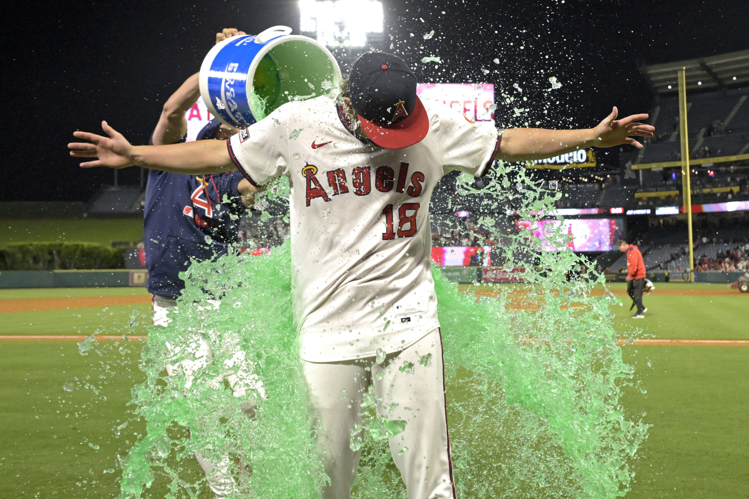 Angels catcher Logan O’Hoppe douses teammate Nolan Schanuel with a...