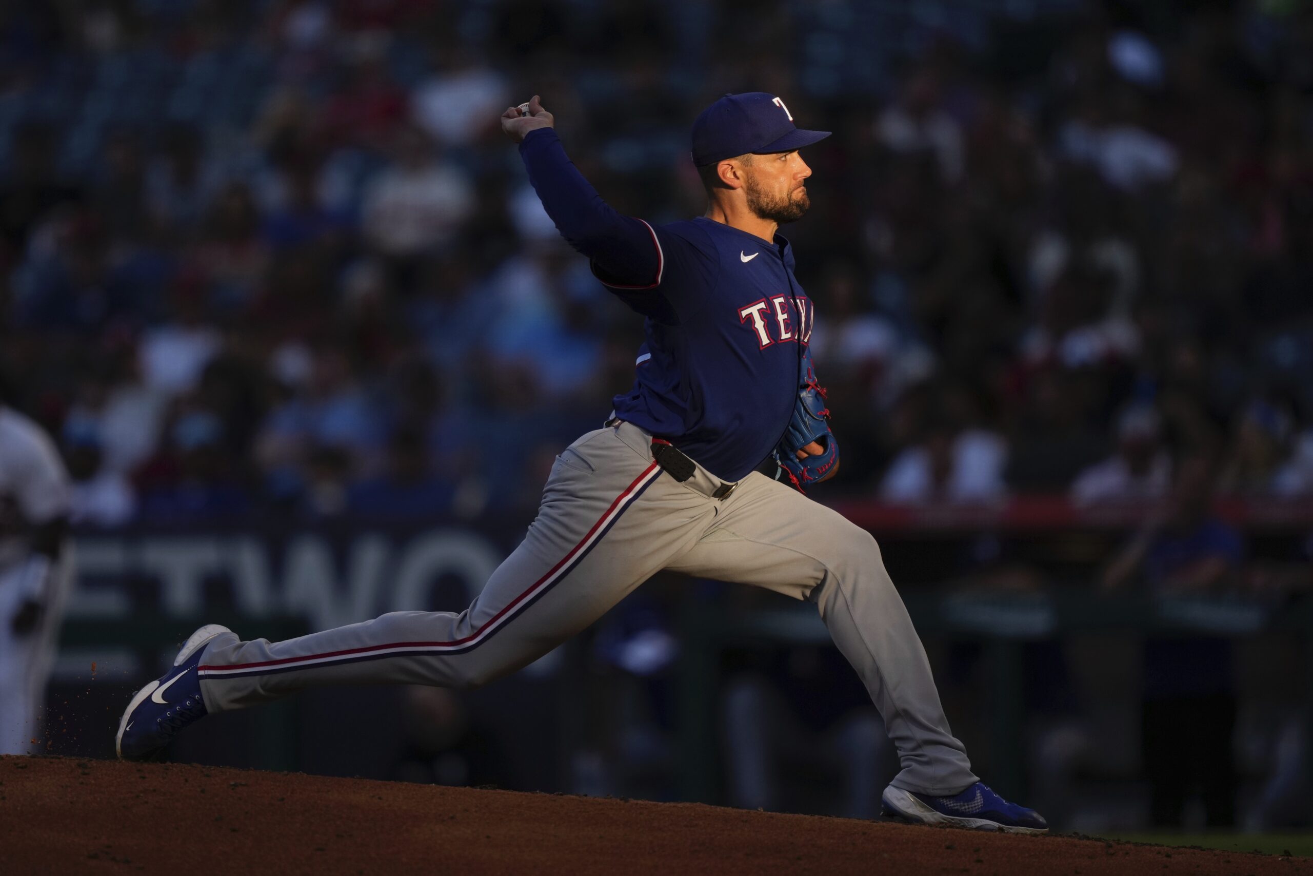 Texas Rangers starting pitcher Nathan Eovaldi throws to the plate...