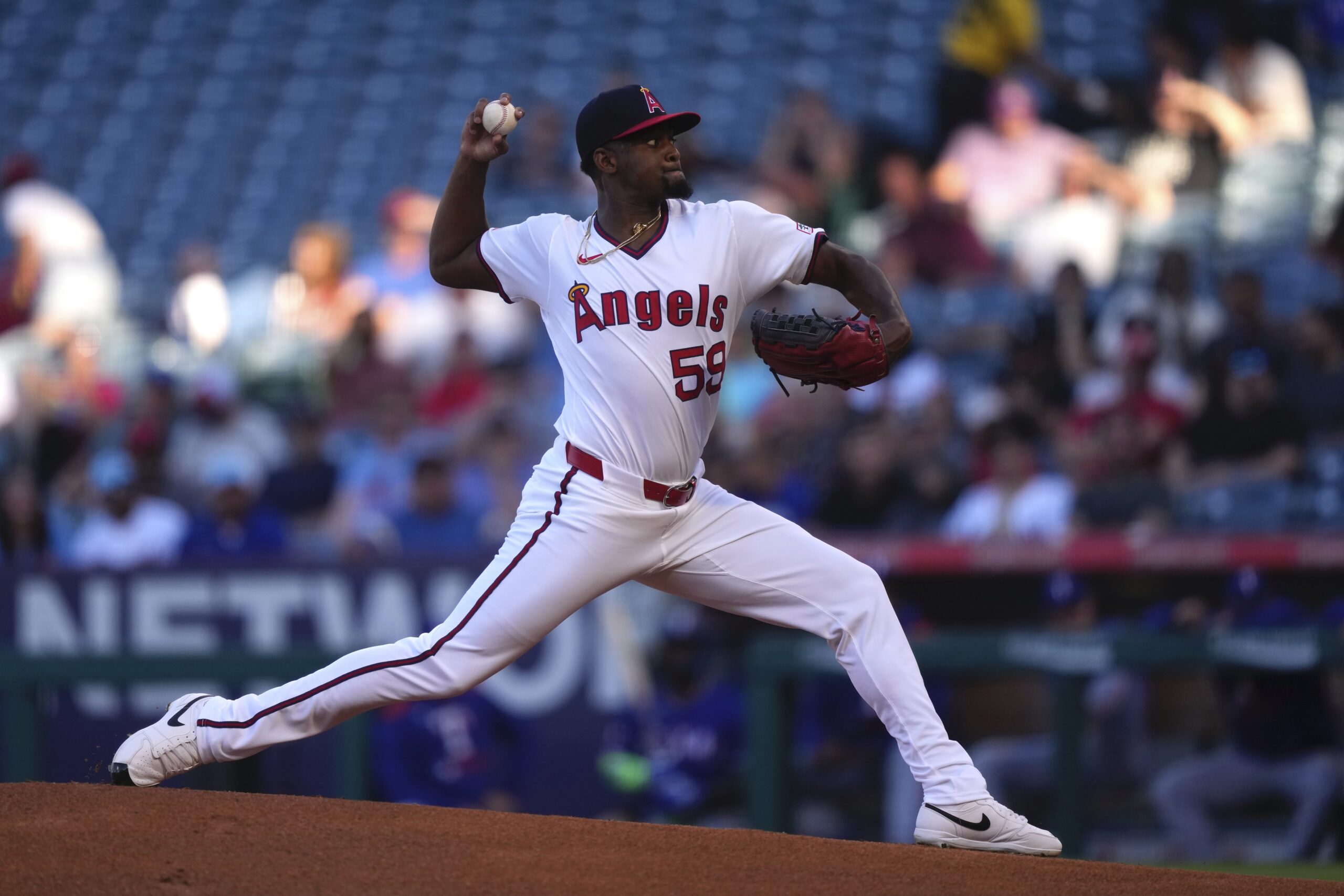 Angels starting pitcher Jose Soriano throws to the plate during...