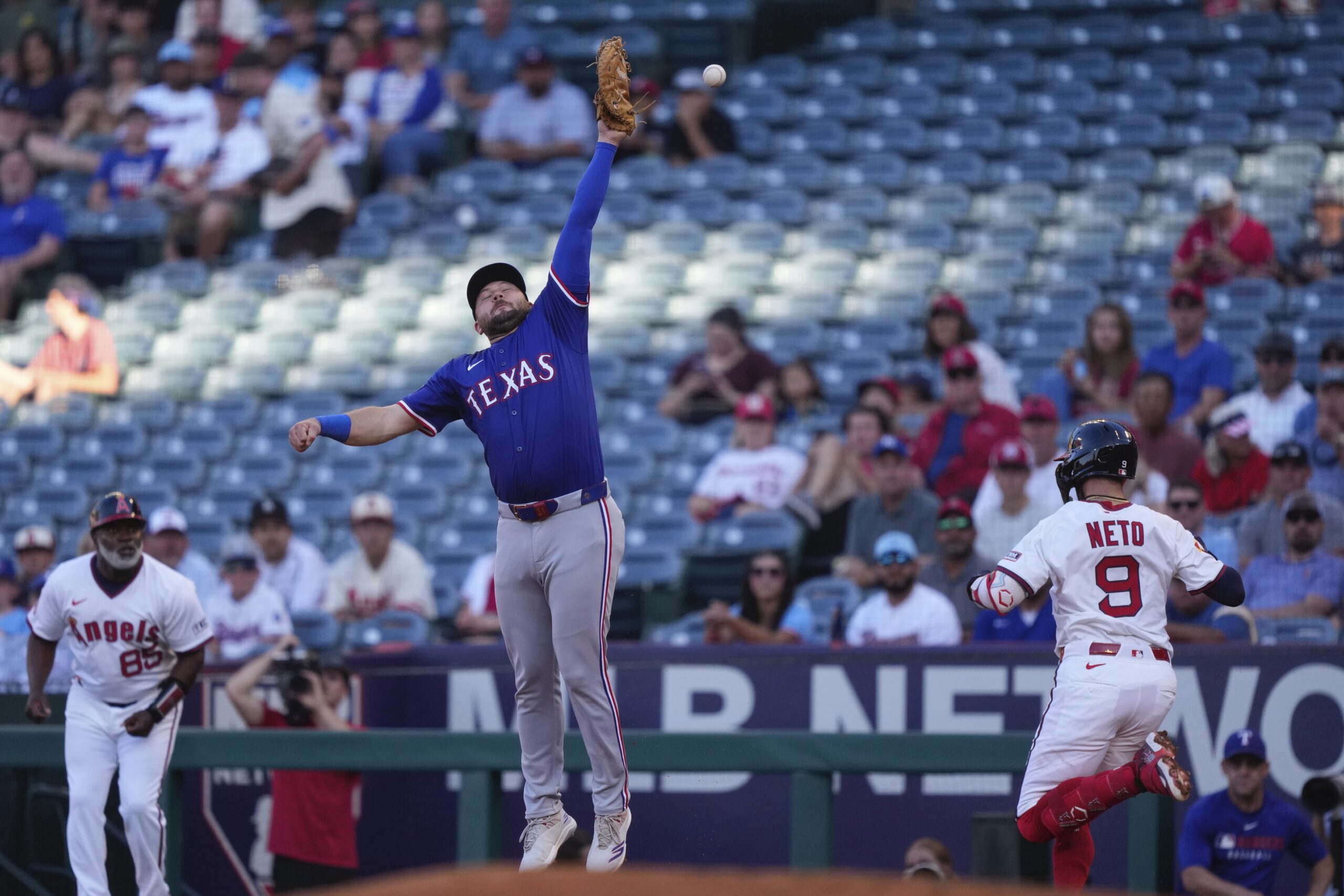The Angels’ Zach Neto is safe at first as Texas...