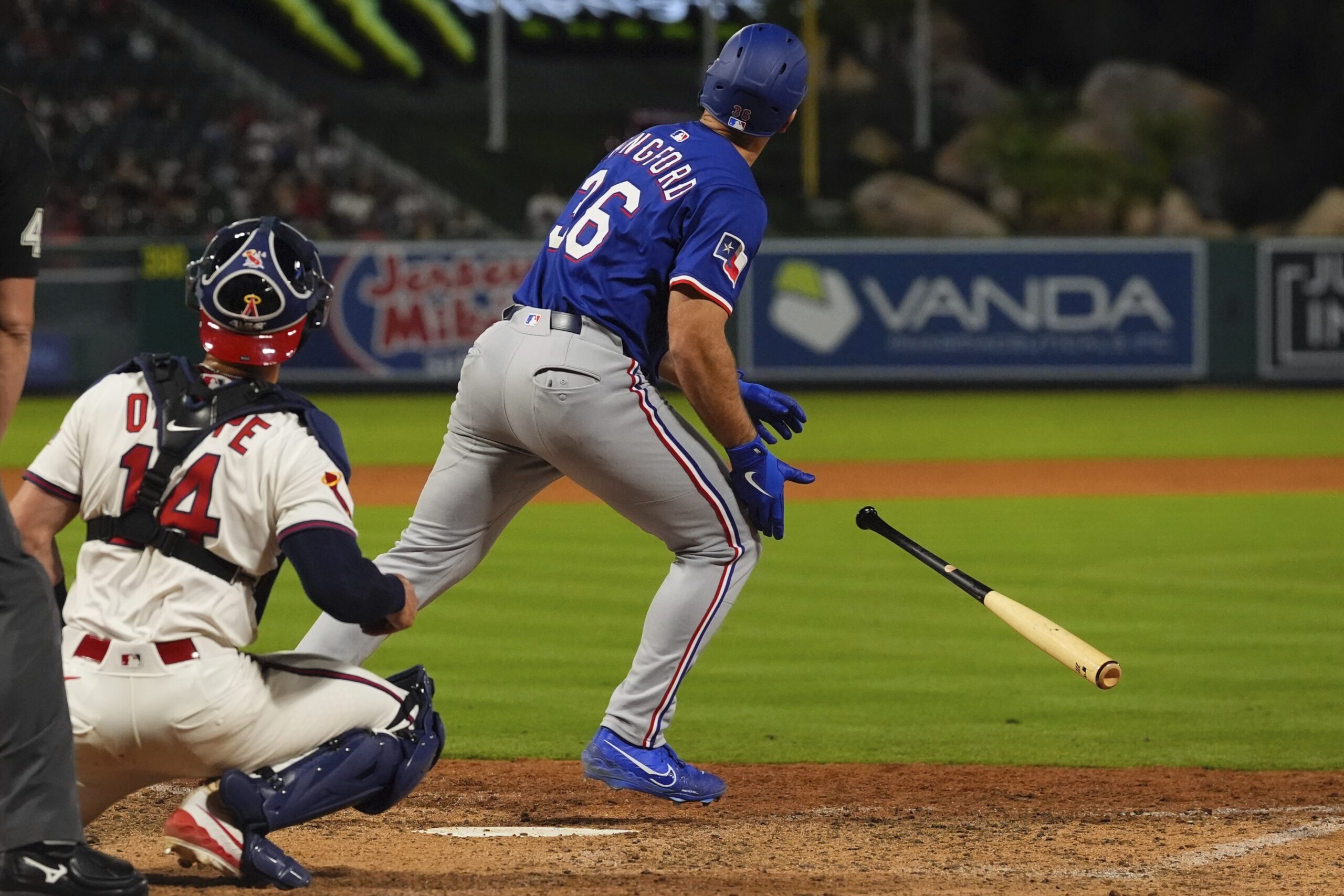 The Texas Rangers’ Wyatt Langford drops his bat as he...