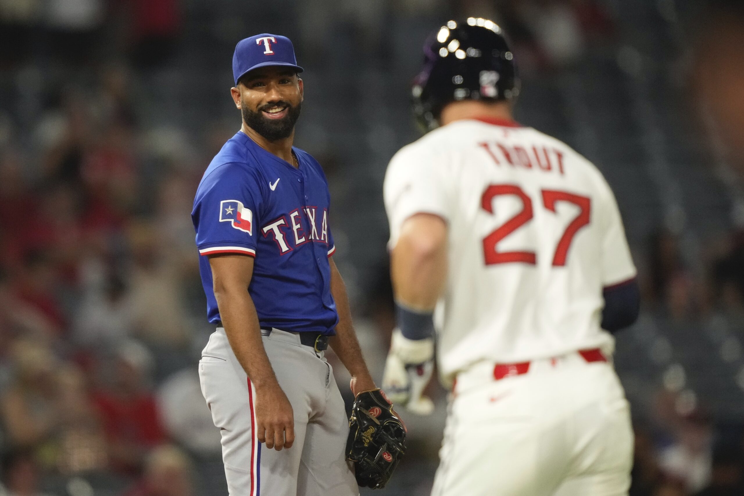 The Texas Rangers’ Ezequiel Duran, left, a position player who...