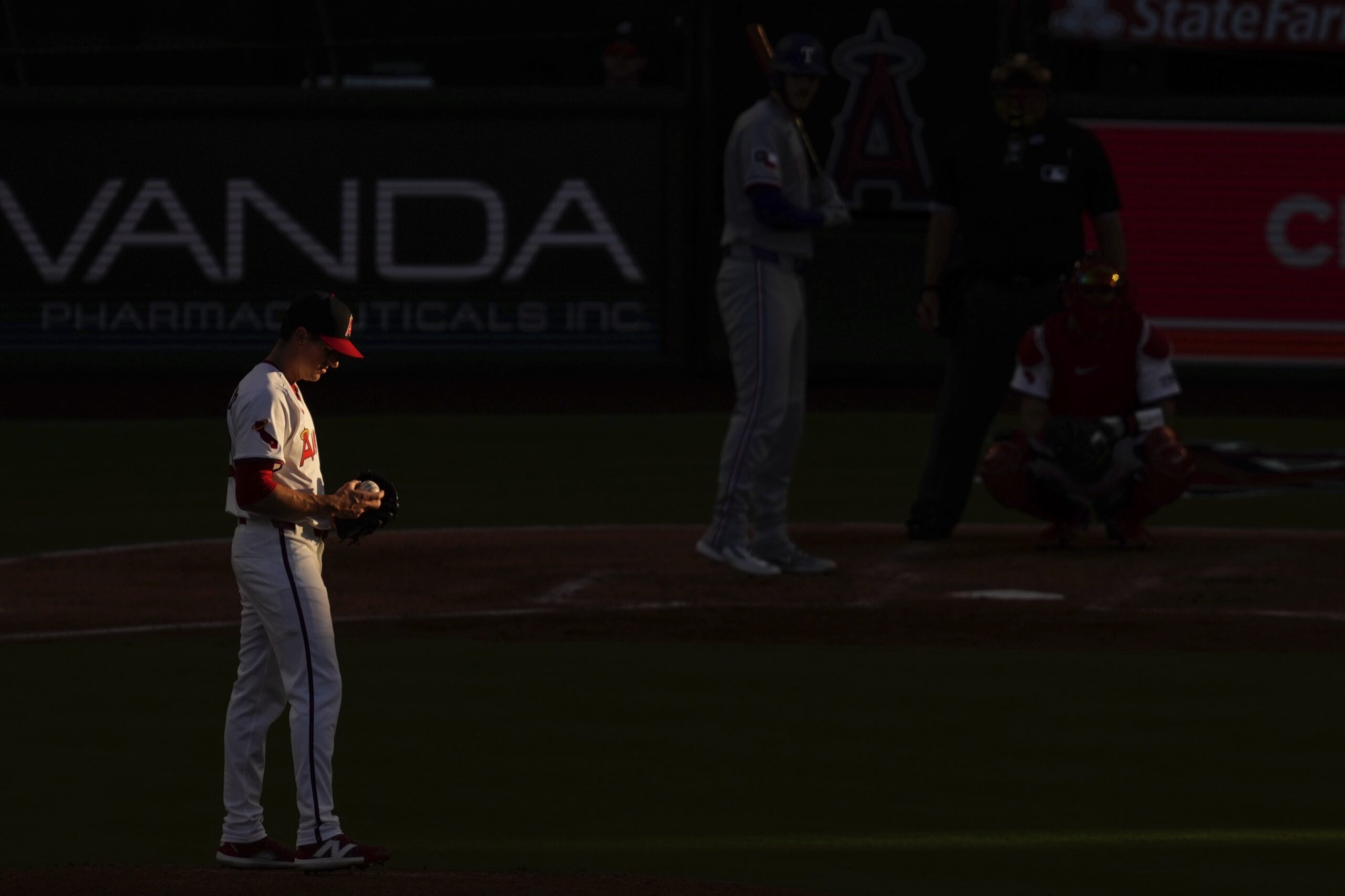 Angels starting pitcher Kyle Hendricks gets set to pitch to...