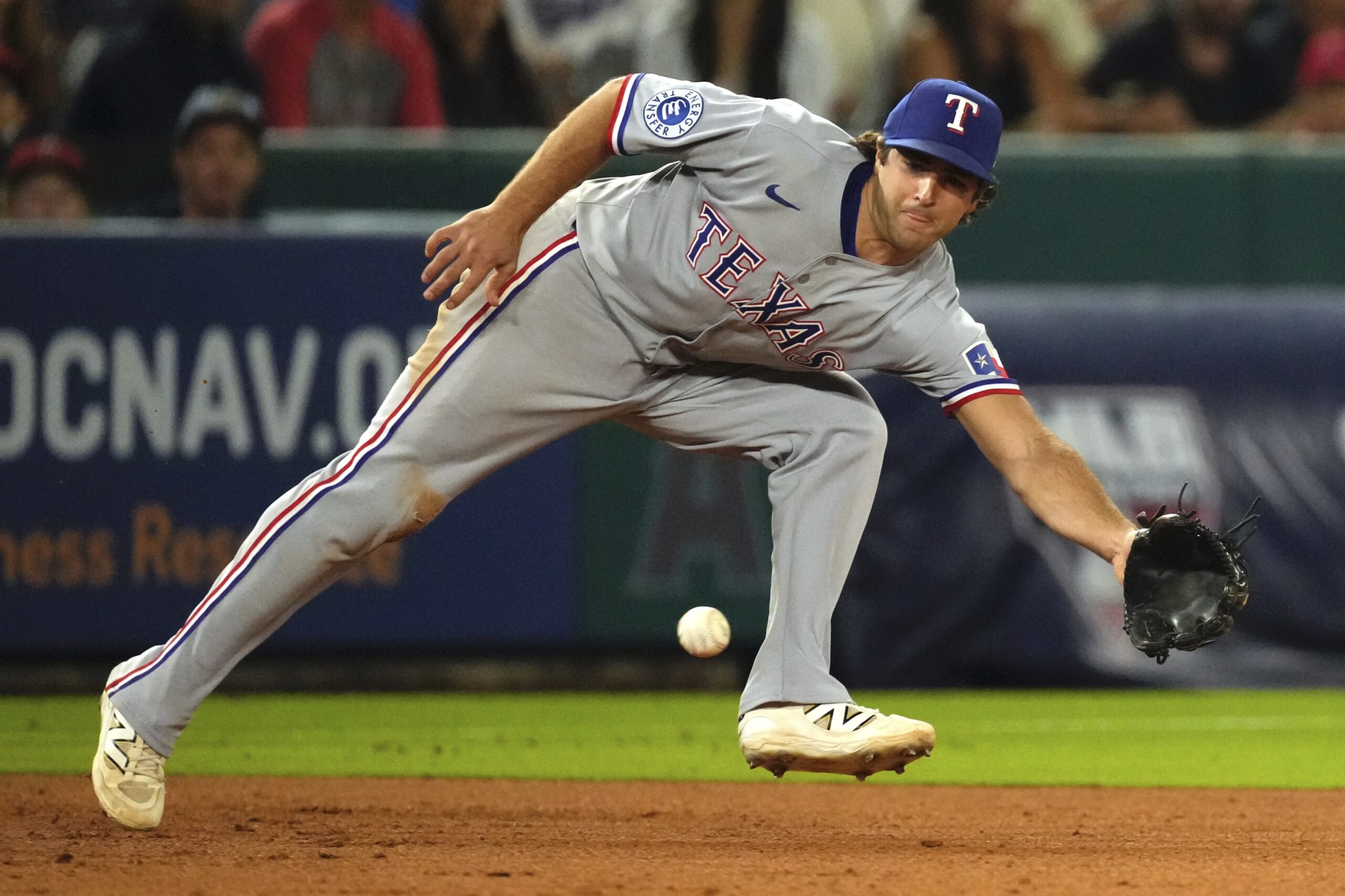 Texas Rangers third baseman Josh Smith fields a ball hit...