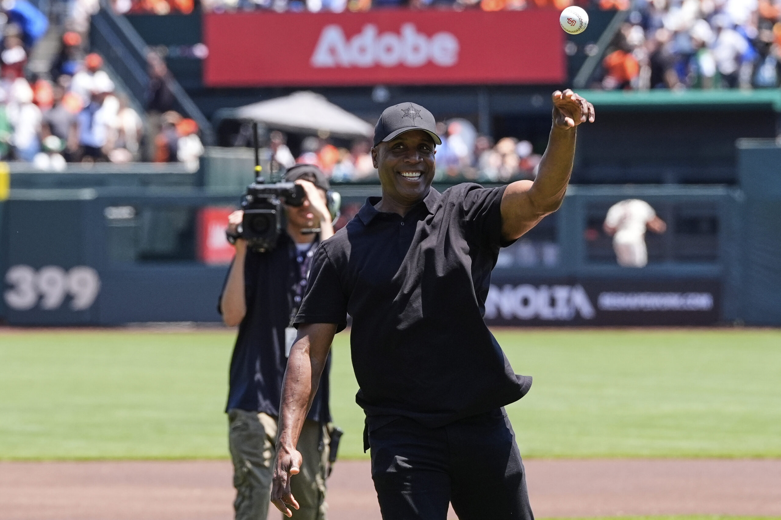 Former professional baseball player Barry Bonds throws a ceremonial first...