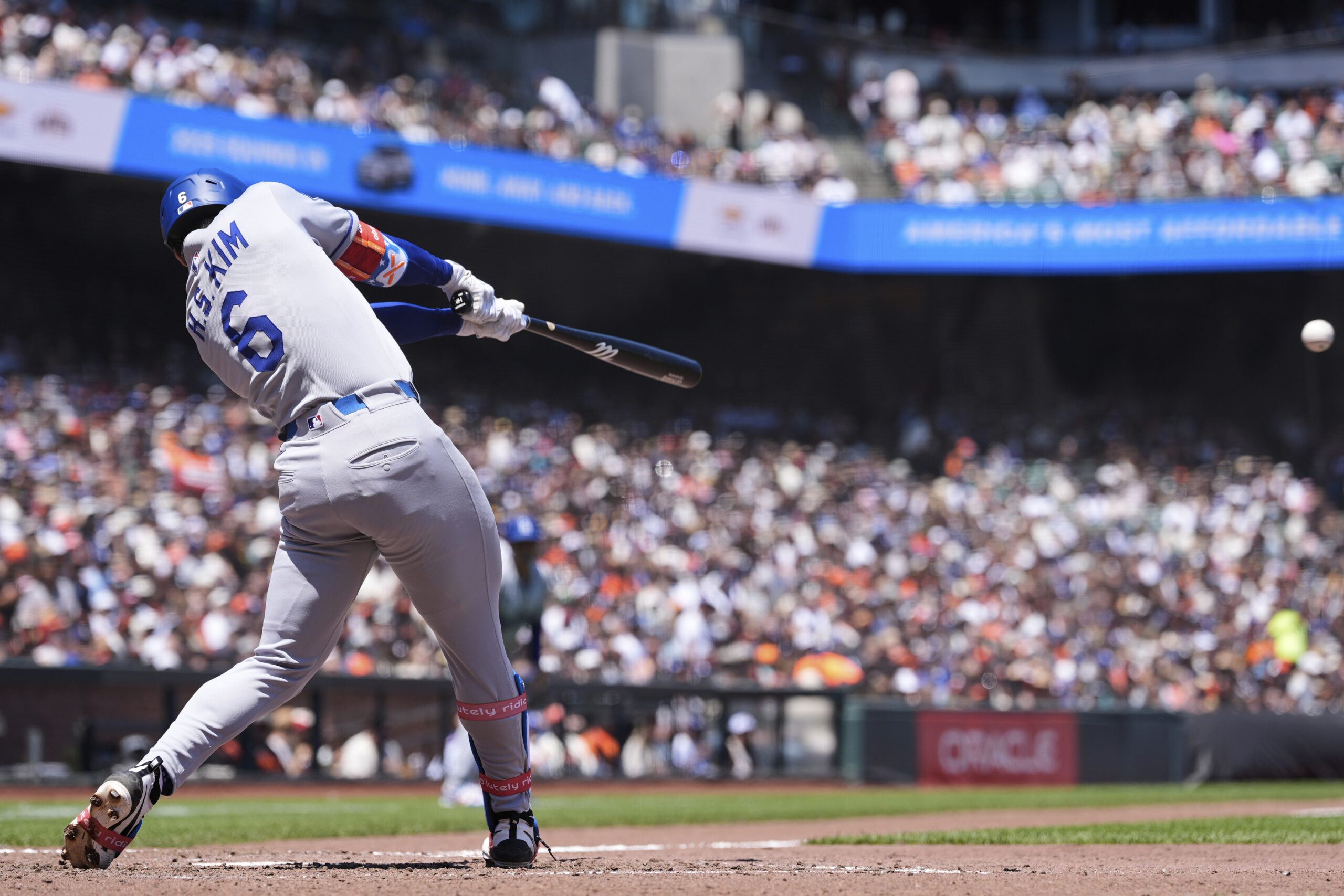 Los Angeles Dodgers’ Hyeseong Kim hits an RBI single against...