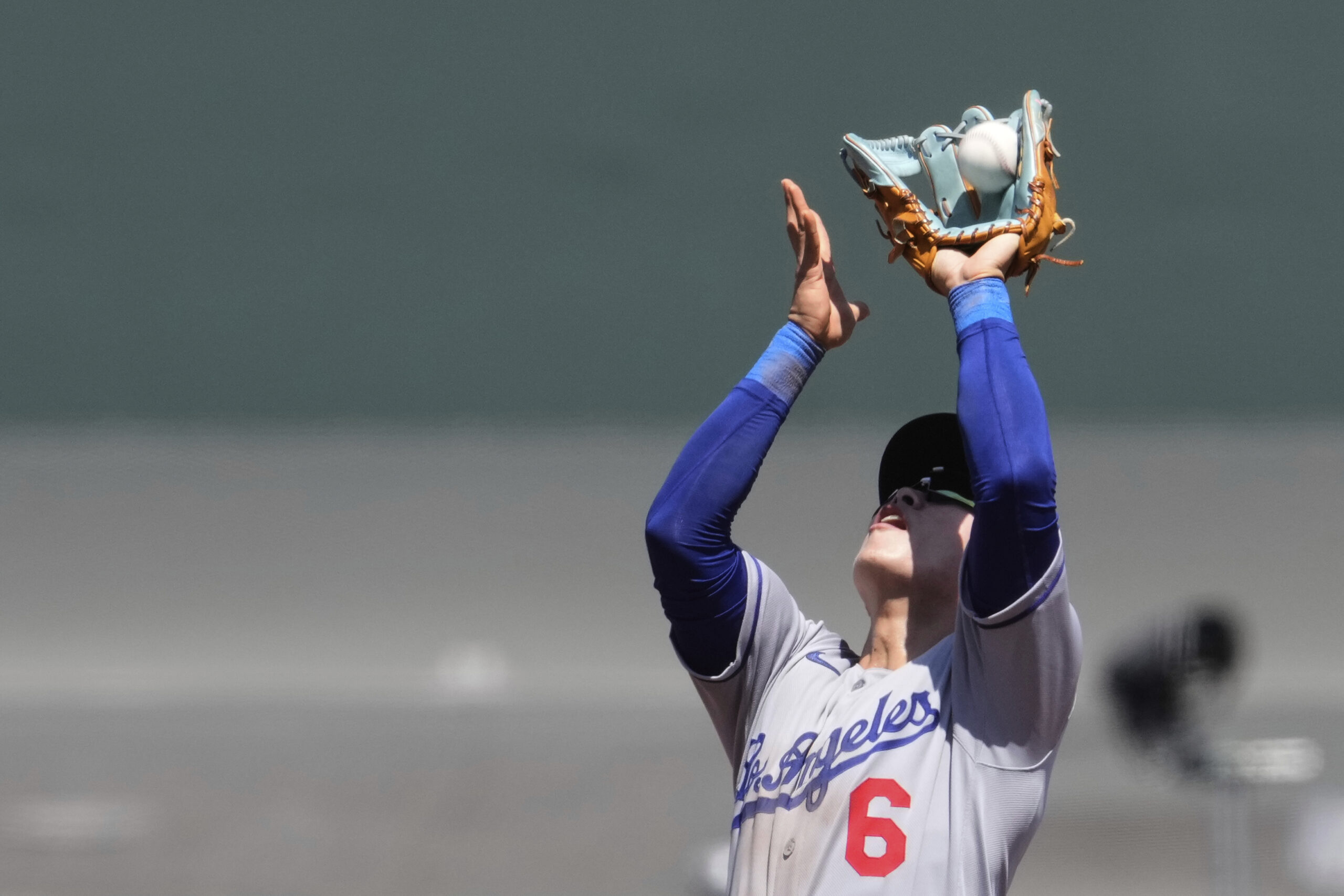 Los Angeles Dodgers second baseman Hyeseong Kim catches a popup...