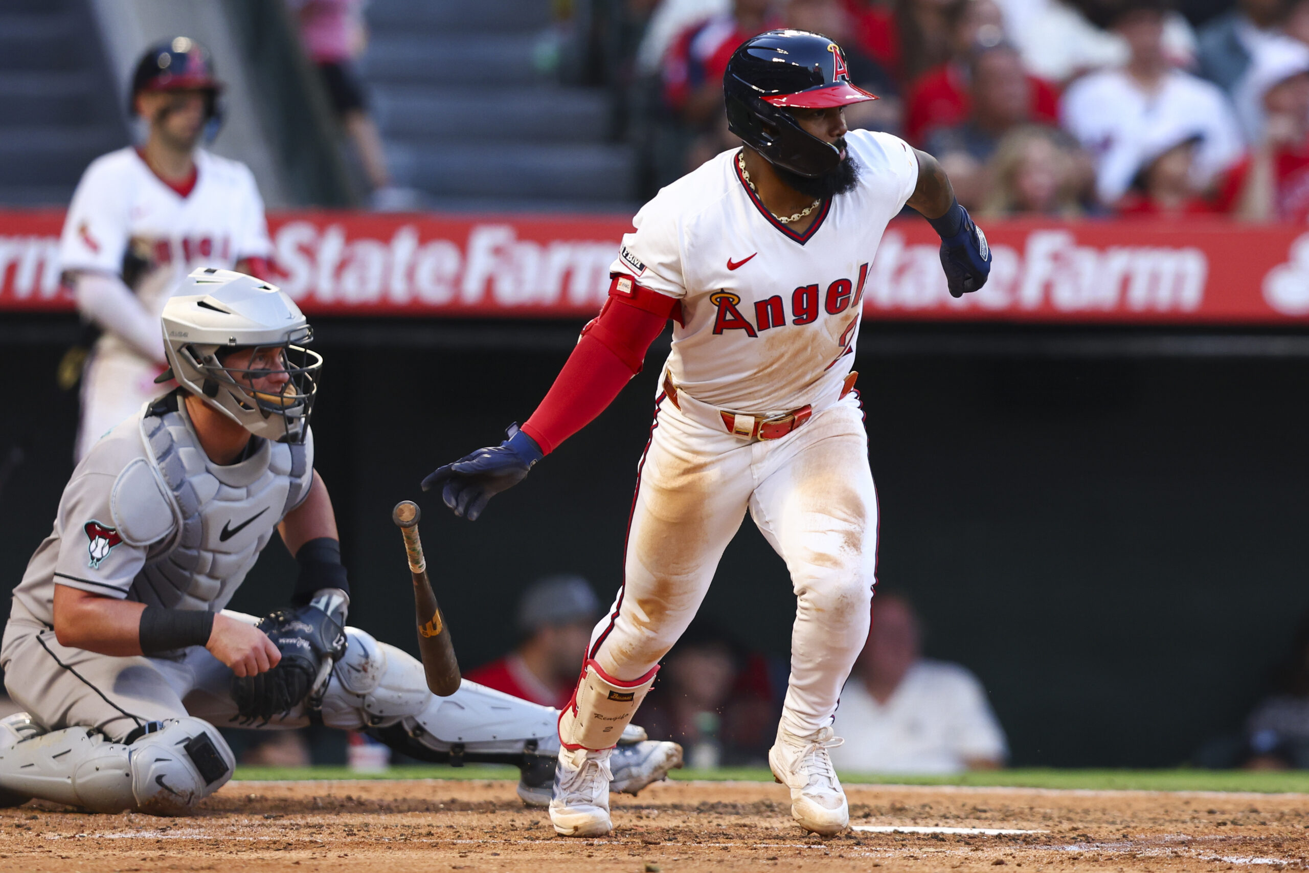Angels’ Luis Rengifo drops his bat after hitting an RBI...