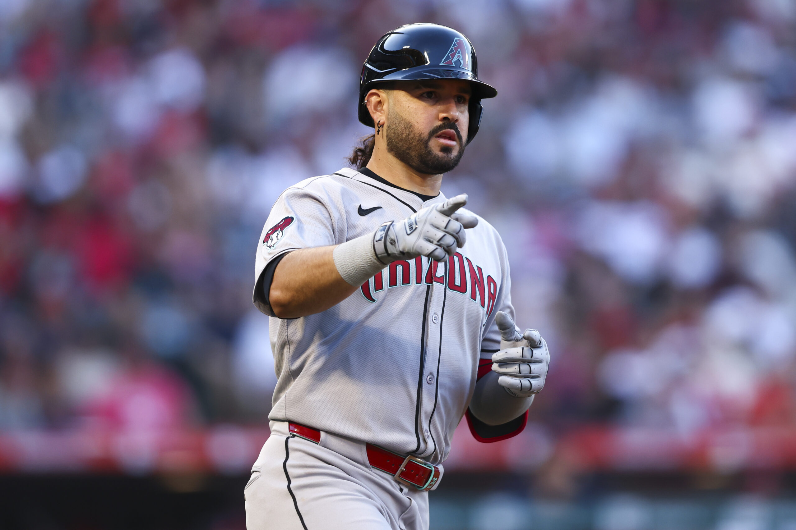 Arizona Diamondbacks’ Eugenio Suárez gestures after hitting a home run...