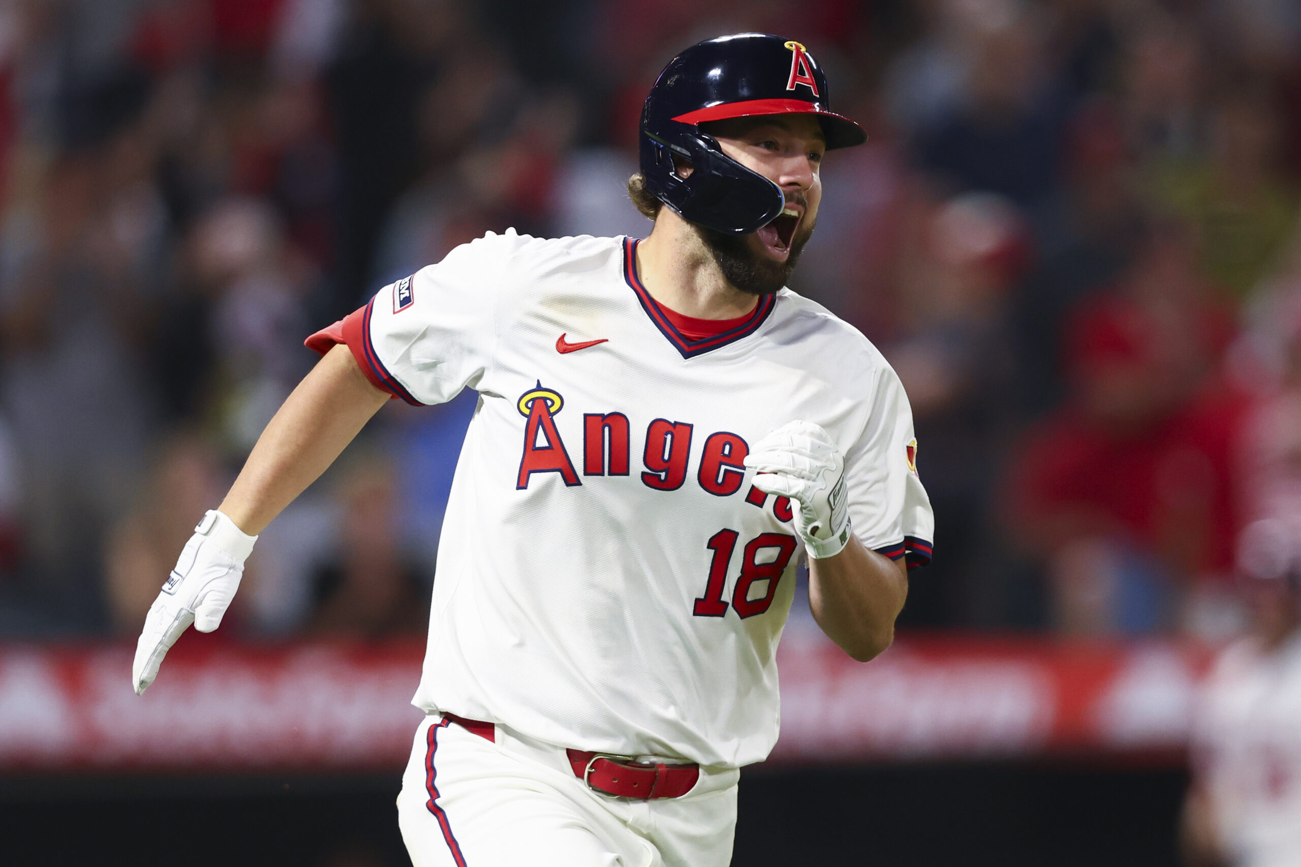 Angels Nolan Schanuel reacts while running towards first base after...